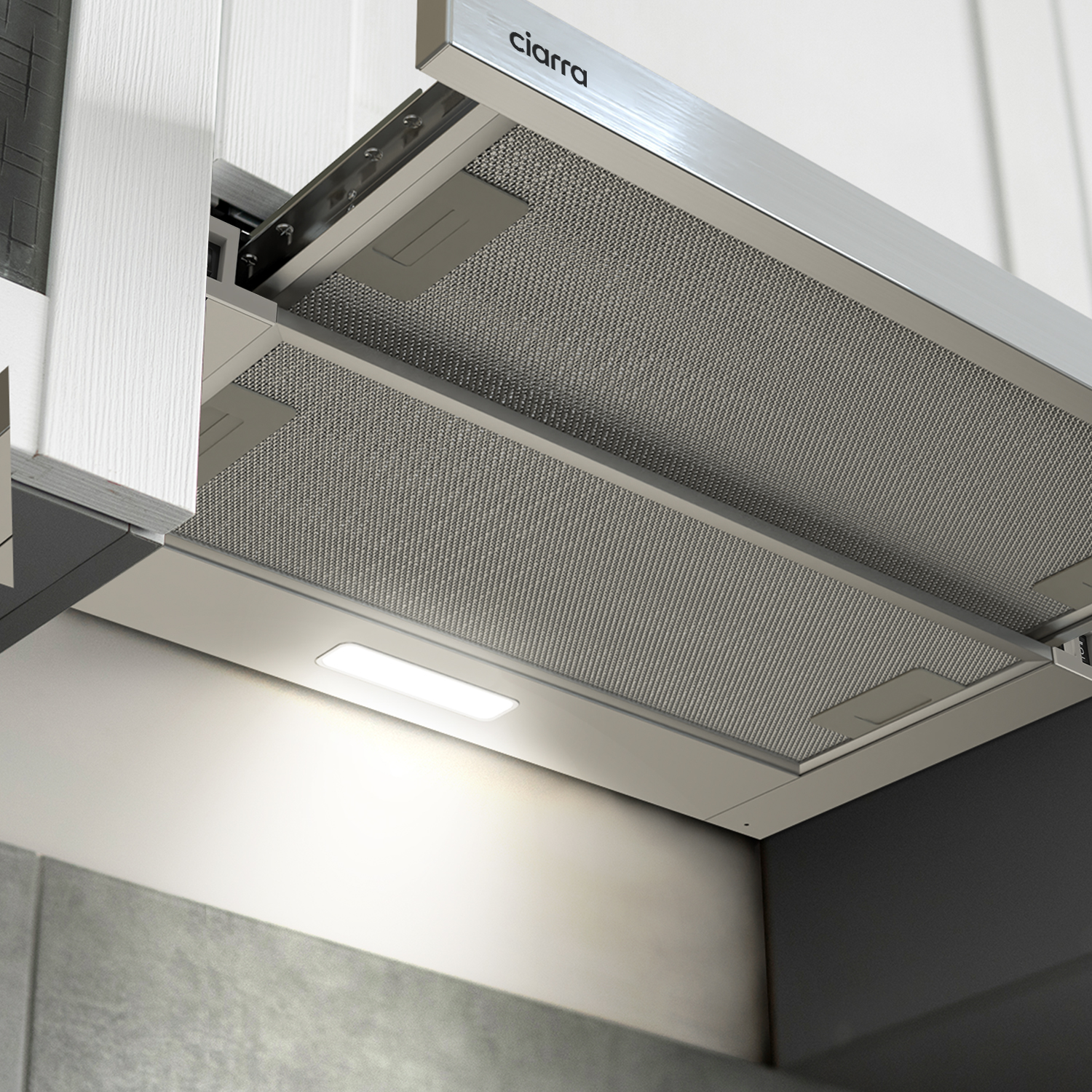 Kitchen range hood, stainless steel, mounted on a white ceiling. The light is on.