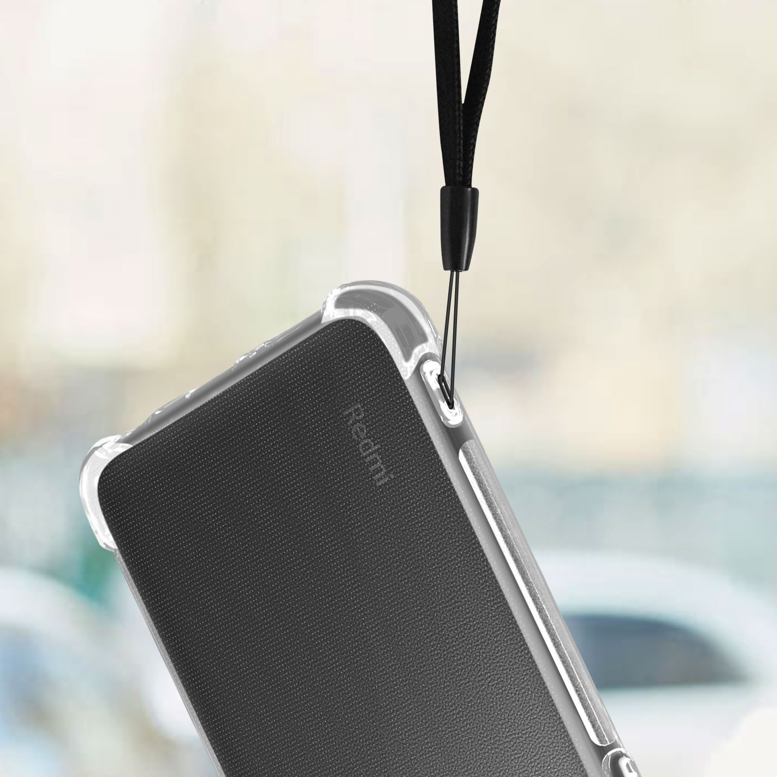 Transparente Handyhülle mit einem schwarzen Redmi-Telefon. Hängt an einem schwarzen Umhängeband.