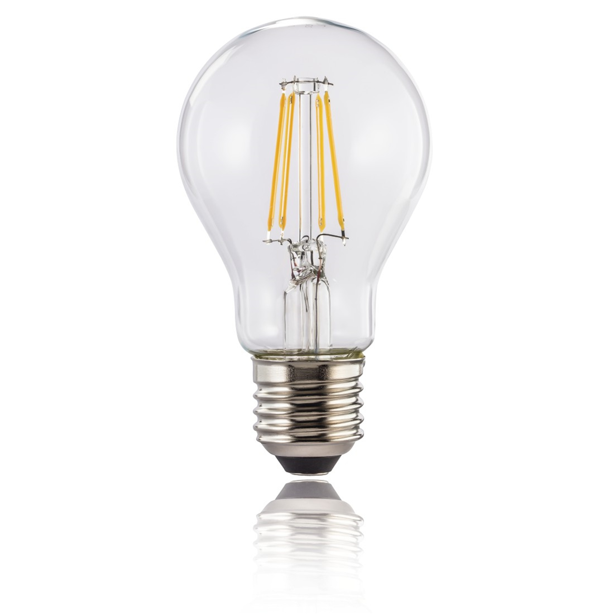 Ampoule transparente avec filaments jaunes, base argentée. Fond blanc.