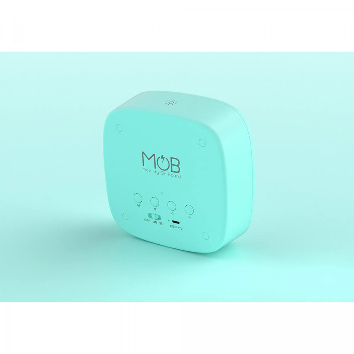 Ein kleines, teal-farbenes Gerät. Der Text „MOB“ und „Mobility On Board“ ist sichtbar. Es gibt Knöpfe und Lichter.