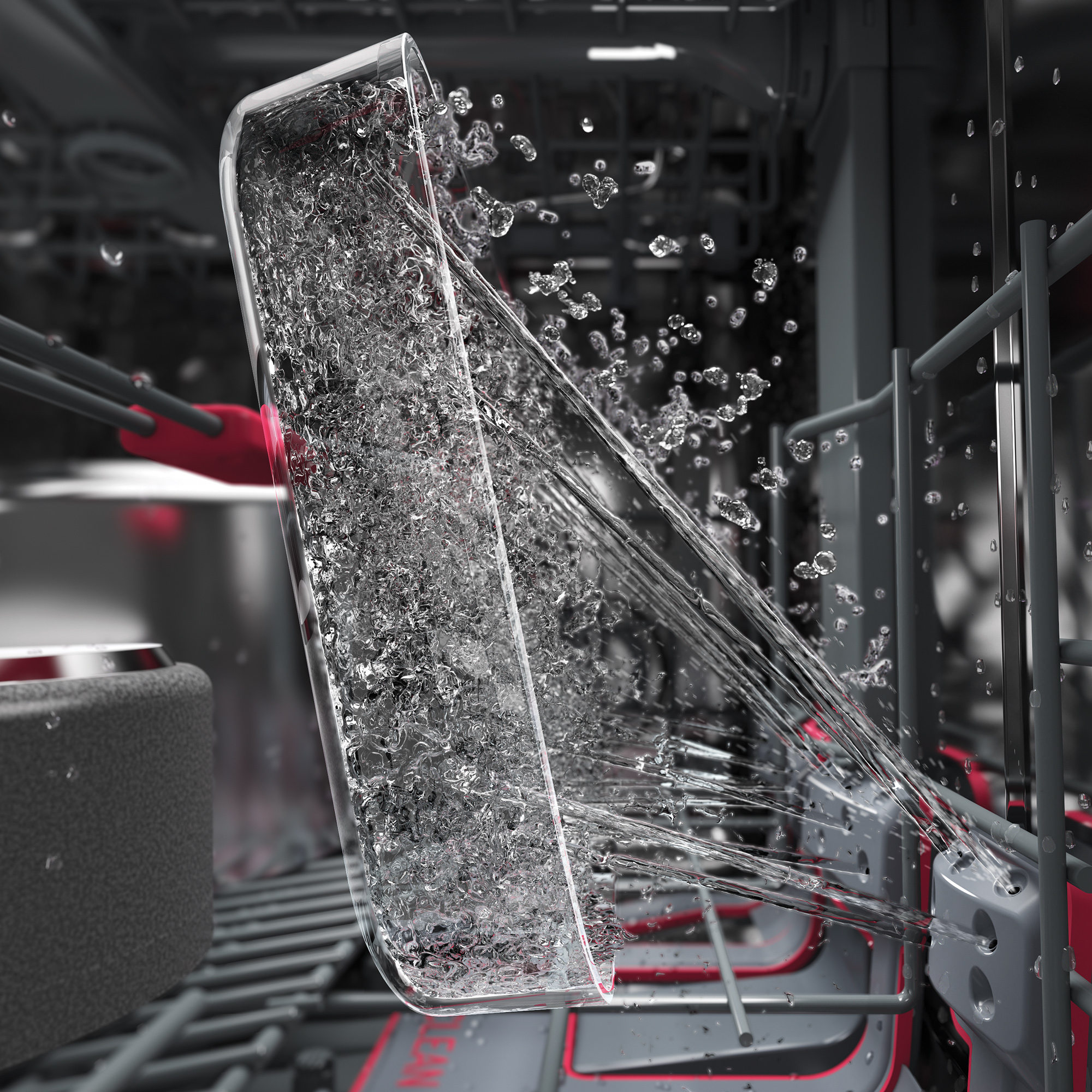 Ein Glas wird in einer Spülmaschine mit Wasser besprüht.