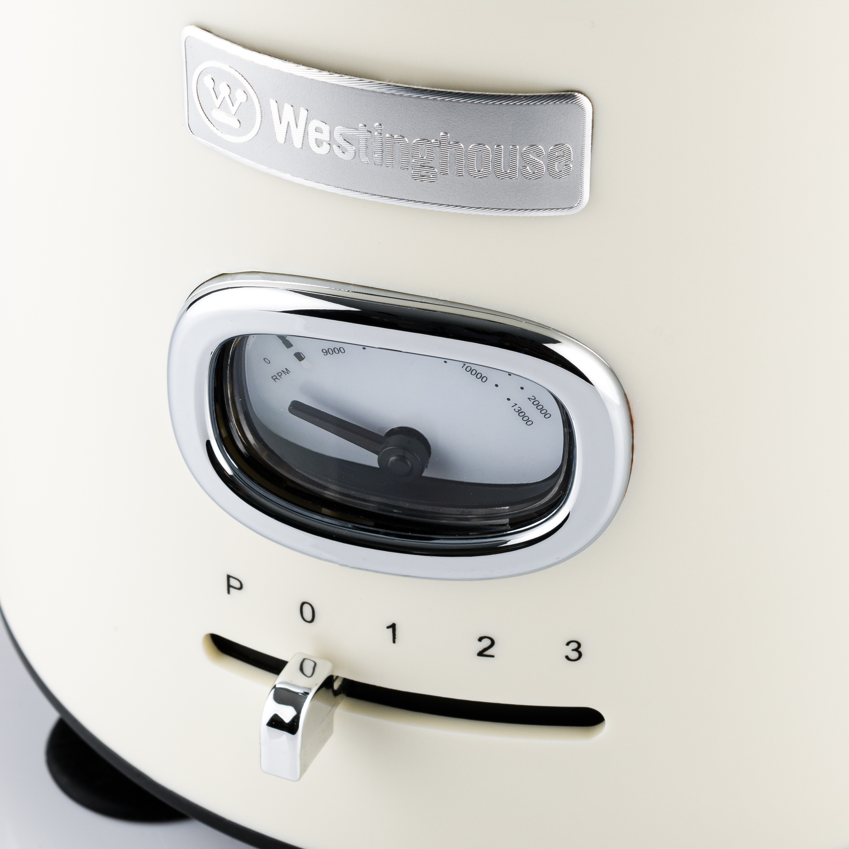 Nahaufnahme der Einstellungen eines cremefarbenen Toasters: Drehregler, Nummernwahl und Westinghouse-Logo.