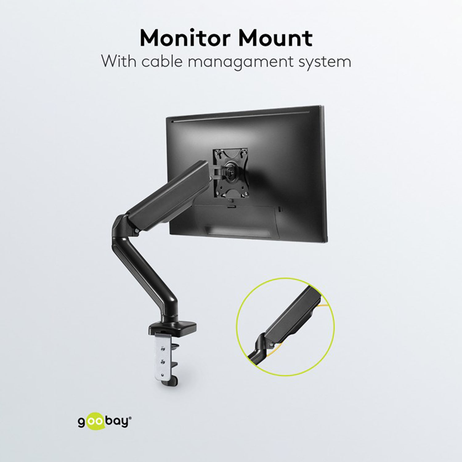 Eine Monitorhalterung mit Kabelmanagementsystem. Sie ist schwarz und auf einer weißen Oberfläche montiert.