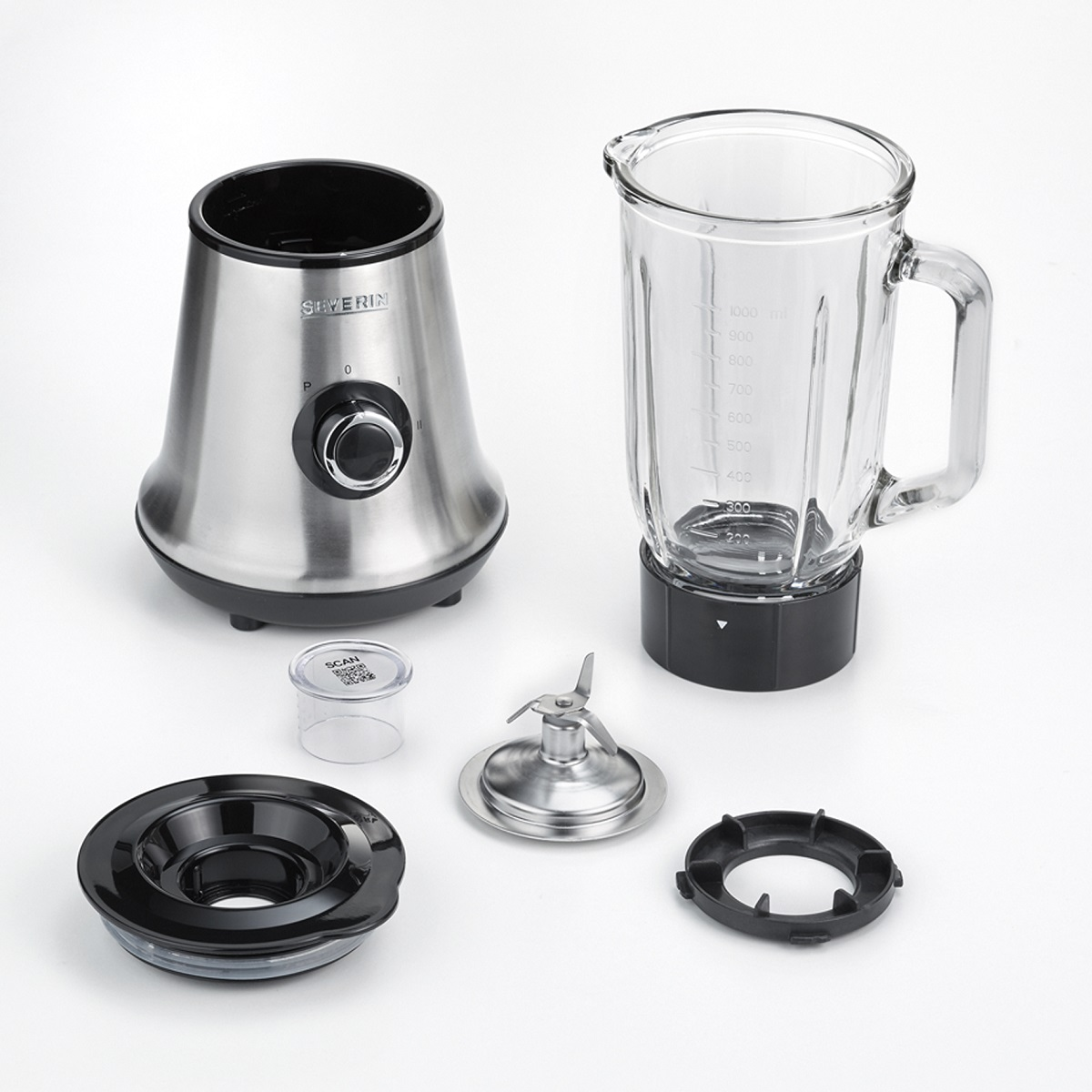 Pièces de blender, dont une base en acier inoxydable, un bocal en verre, une lame et d'autres composants noirs.