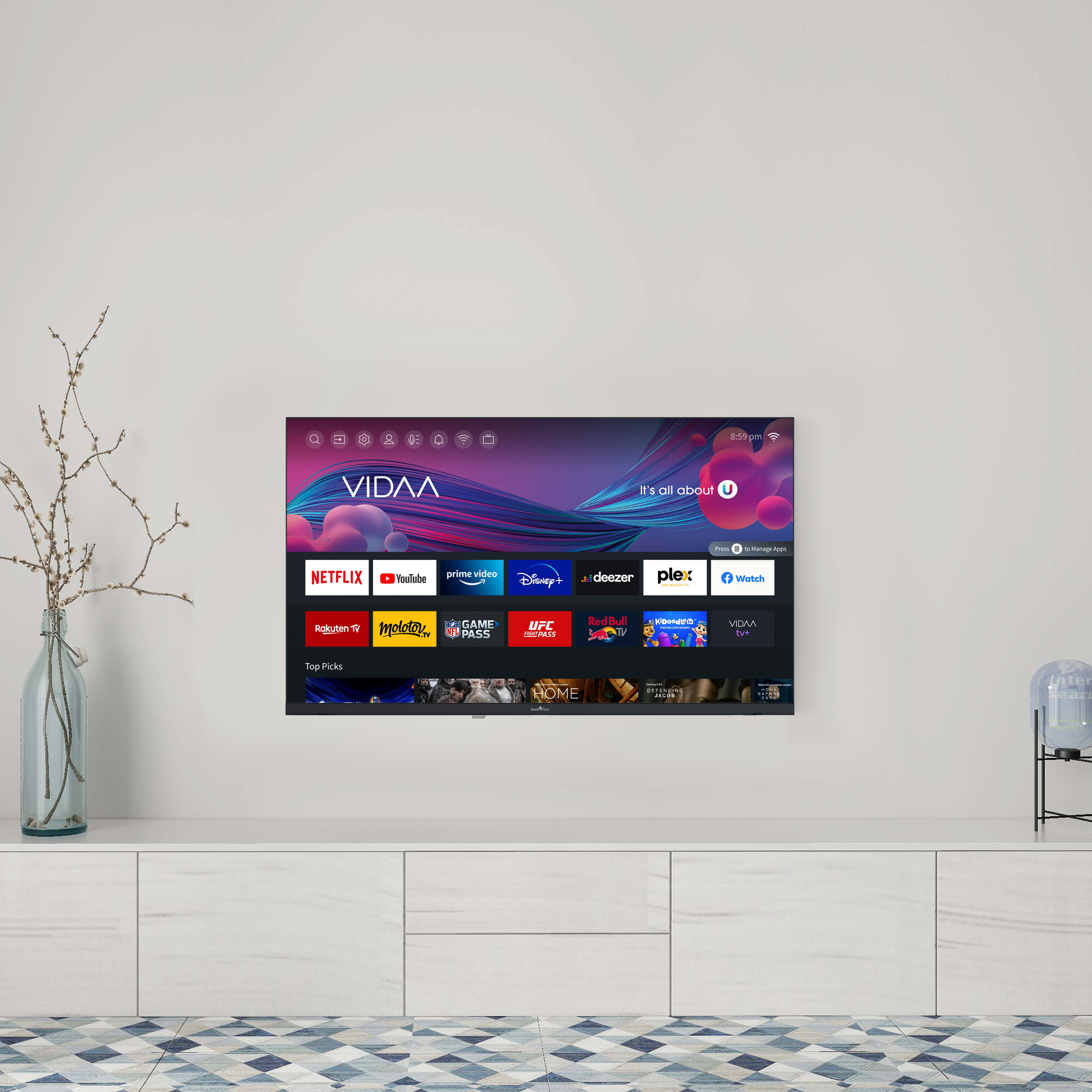 Telewizor zamontowany na białej szafce. Telewizor wyświetla kolorowy interfejs.