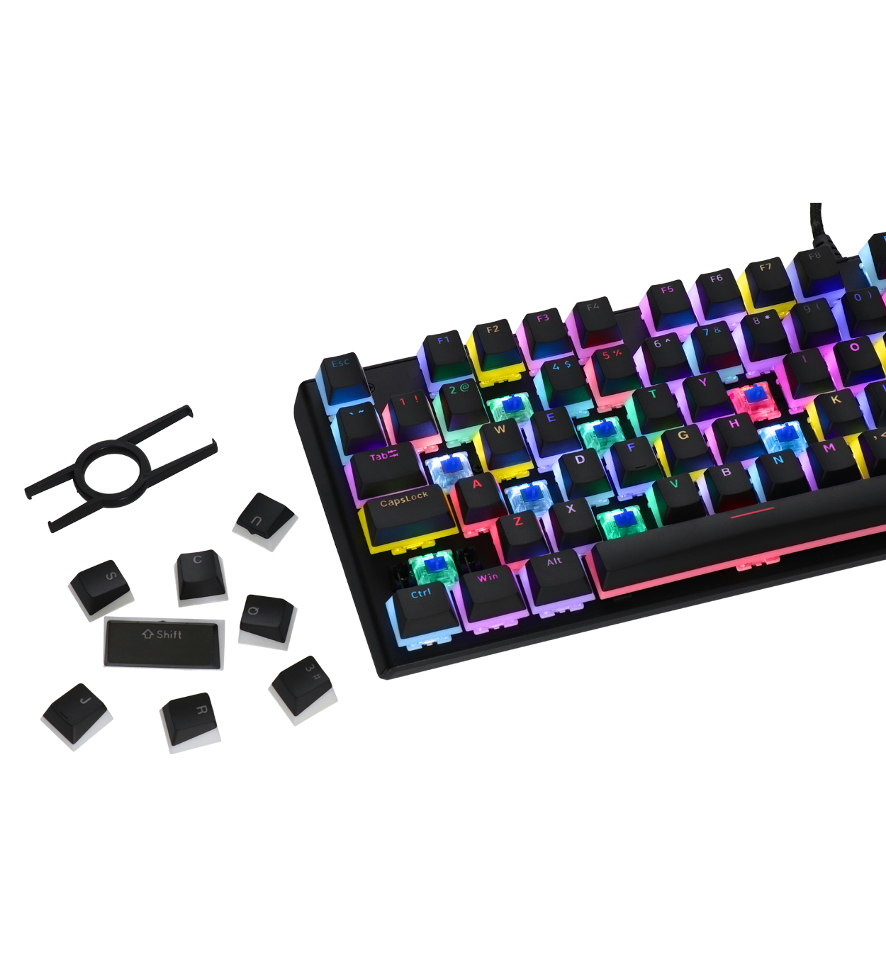 Teclado con teclas retiradas. Muestra teclas, un extractor de teclas y un teclado mecánico.