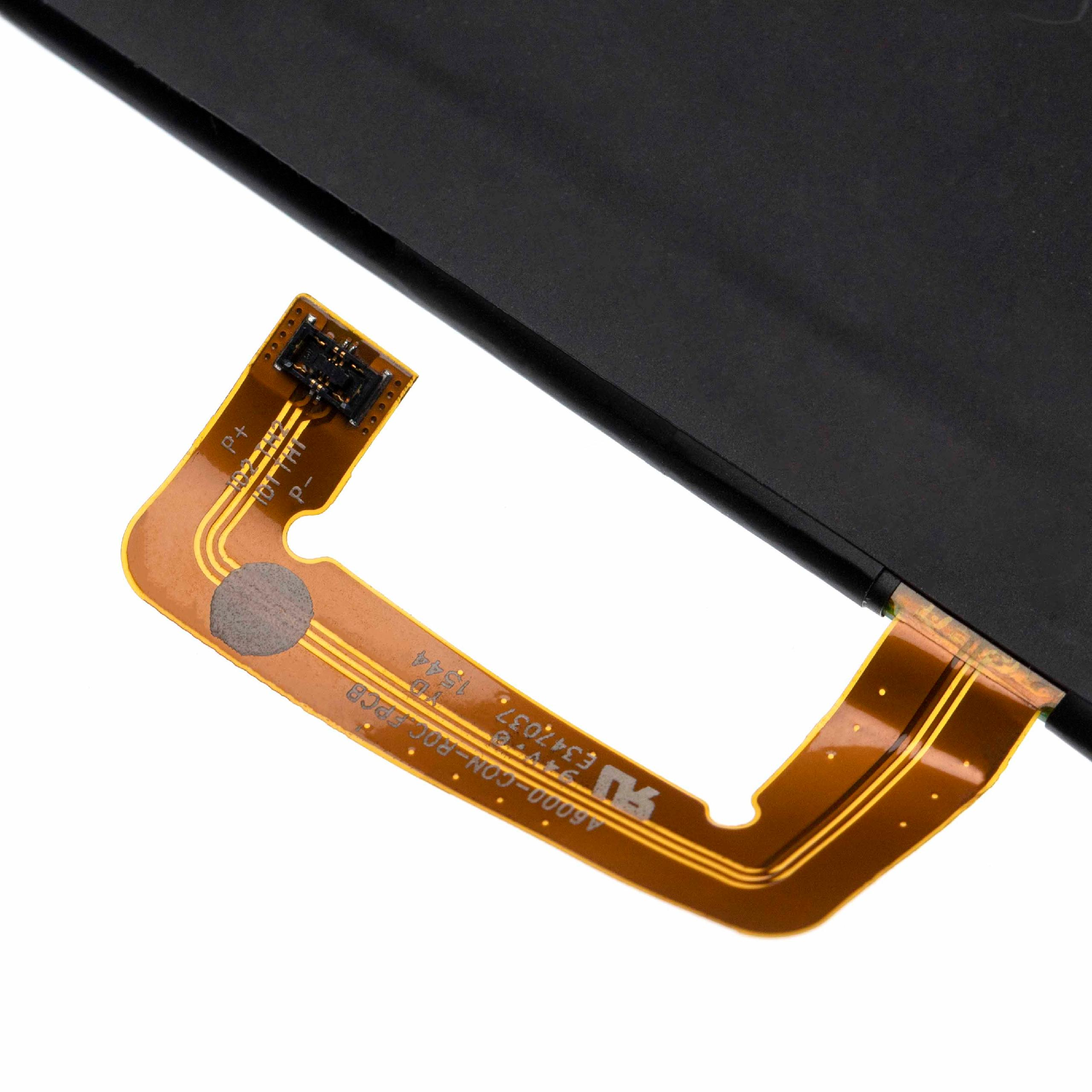 Nahaufnahme einer braunen und goldenen flexiblen Leiterplatte mit Text und einer schwarzen Batterie.