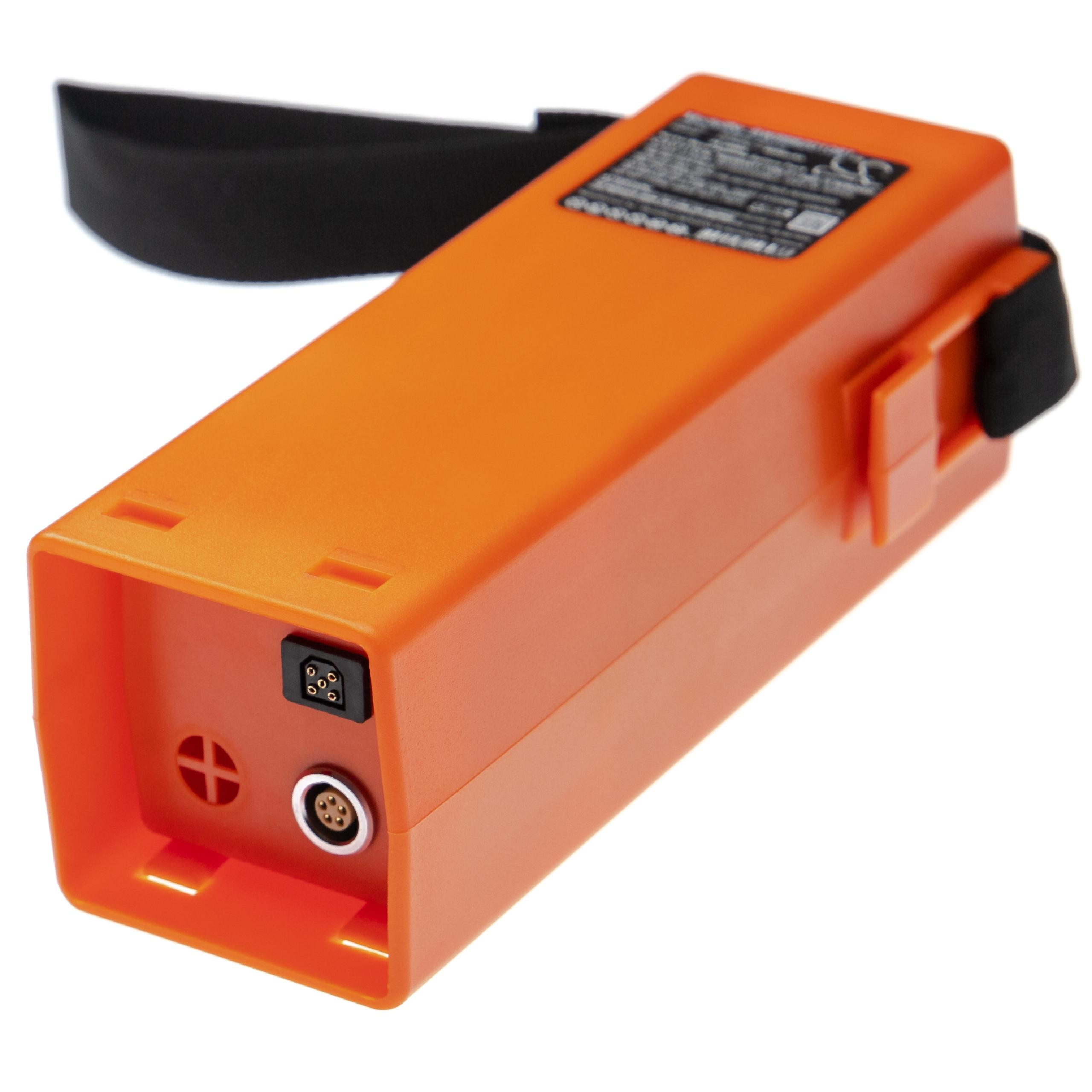 Orangene Batterie mit schwarzem Griff und Anschluss. Die Batterie hat ein Etikett.