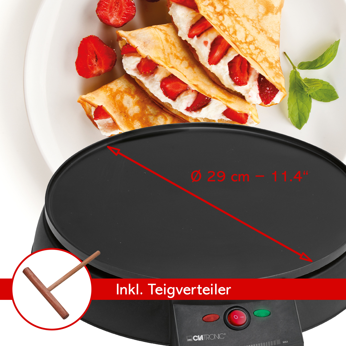 Naleśniki z kremem i truskawkami na czarnej płycie grillowej. Widoczny jest również drewniany rozsmarowywacz.