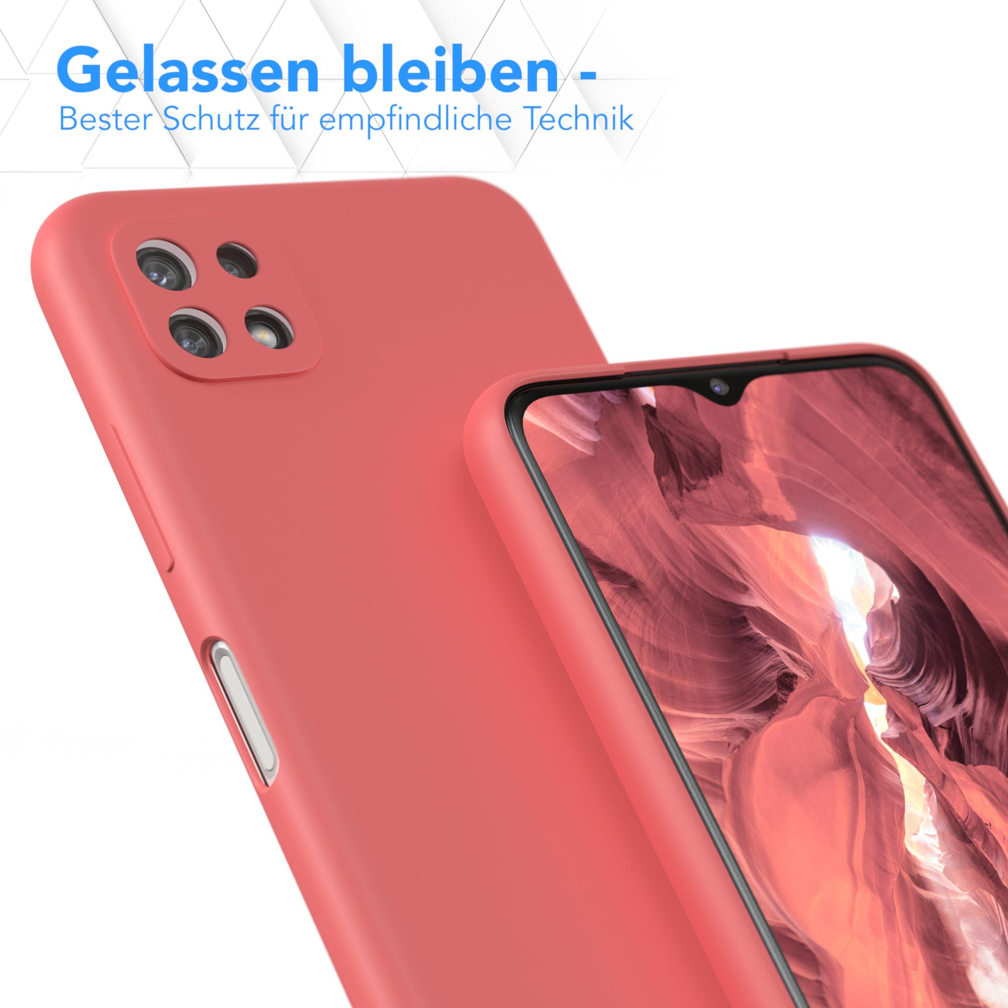 Rote Handyhülle mit einem Telefon darin. Text auf Deutsch ist sichtbar.