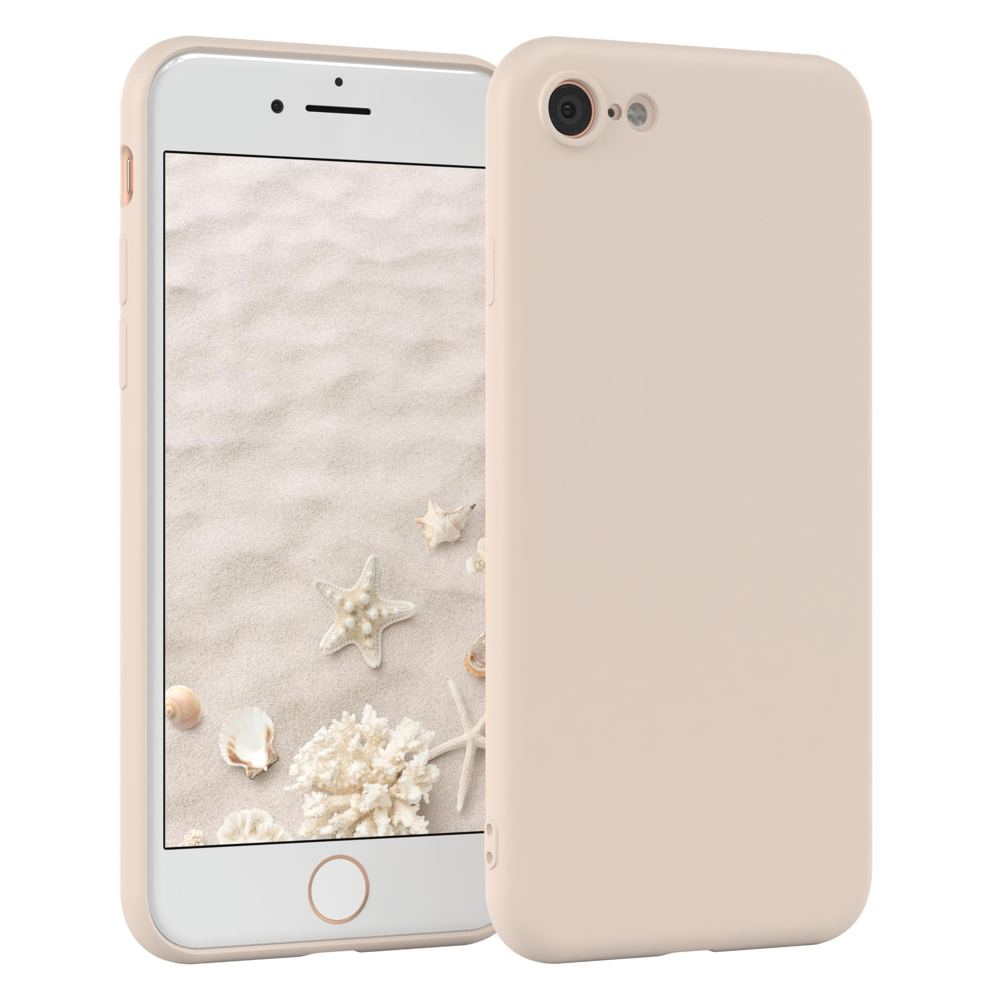 Telefon mit Sandhintergrund und Hülle, Muscheln und Seesternen.