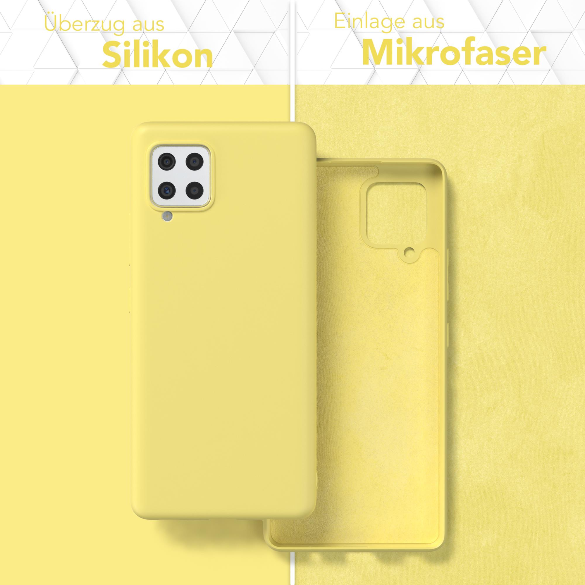 Handyhülle mit Telefon darin. Gelber Hintergrund. Text: Silikon-Cover.