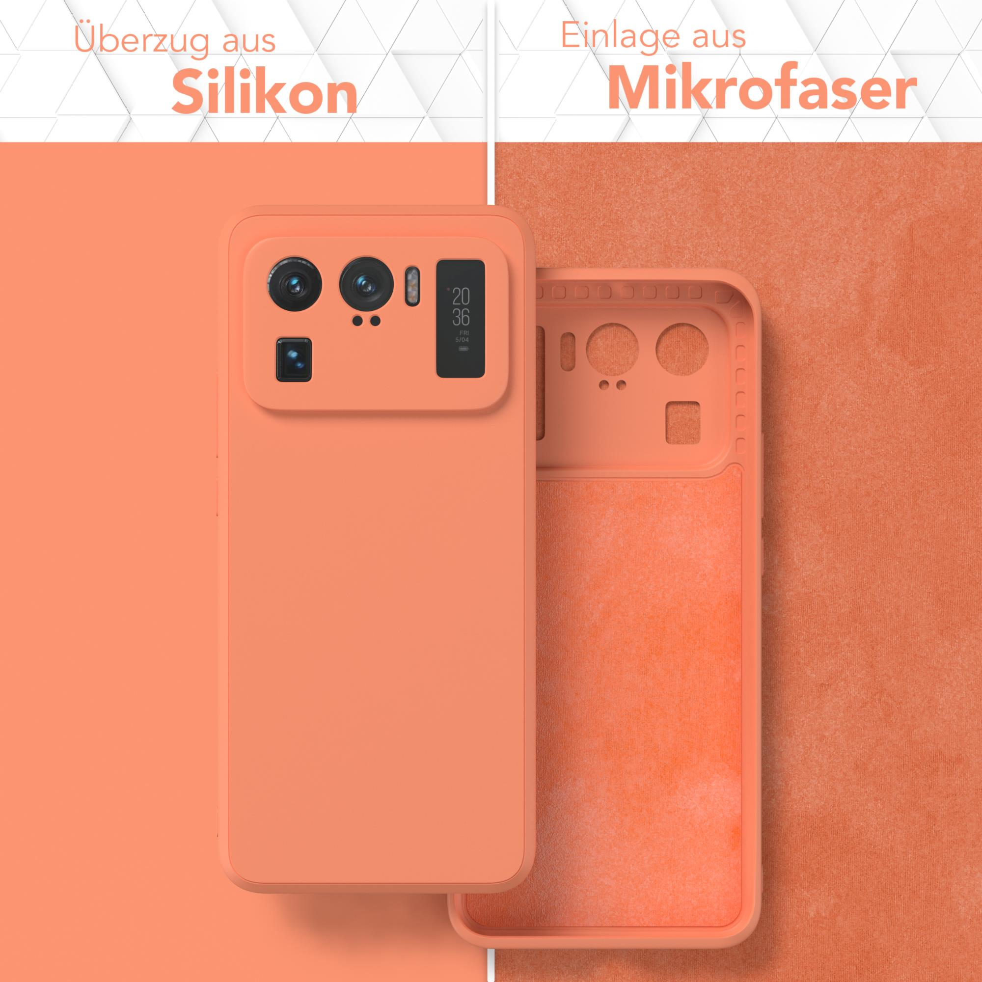 Orangefarbene Handyhülle mit Telefon, innen und außen. Weißer Text: Überzug aus Silikon, Einlage aus Mikrofaser.