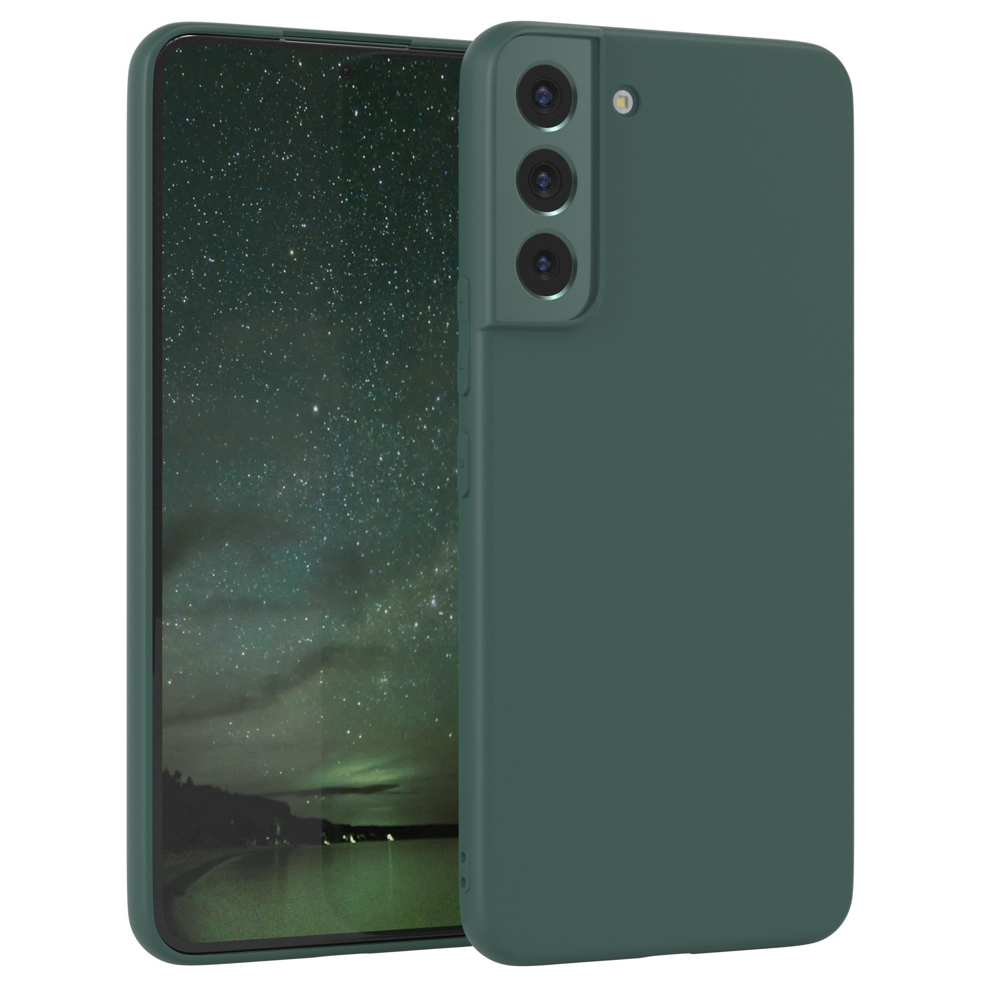 Grüne Handyhülle mit Telefon. Das Telefon befindet sich links von der Hülle.