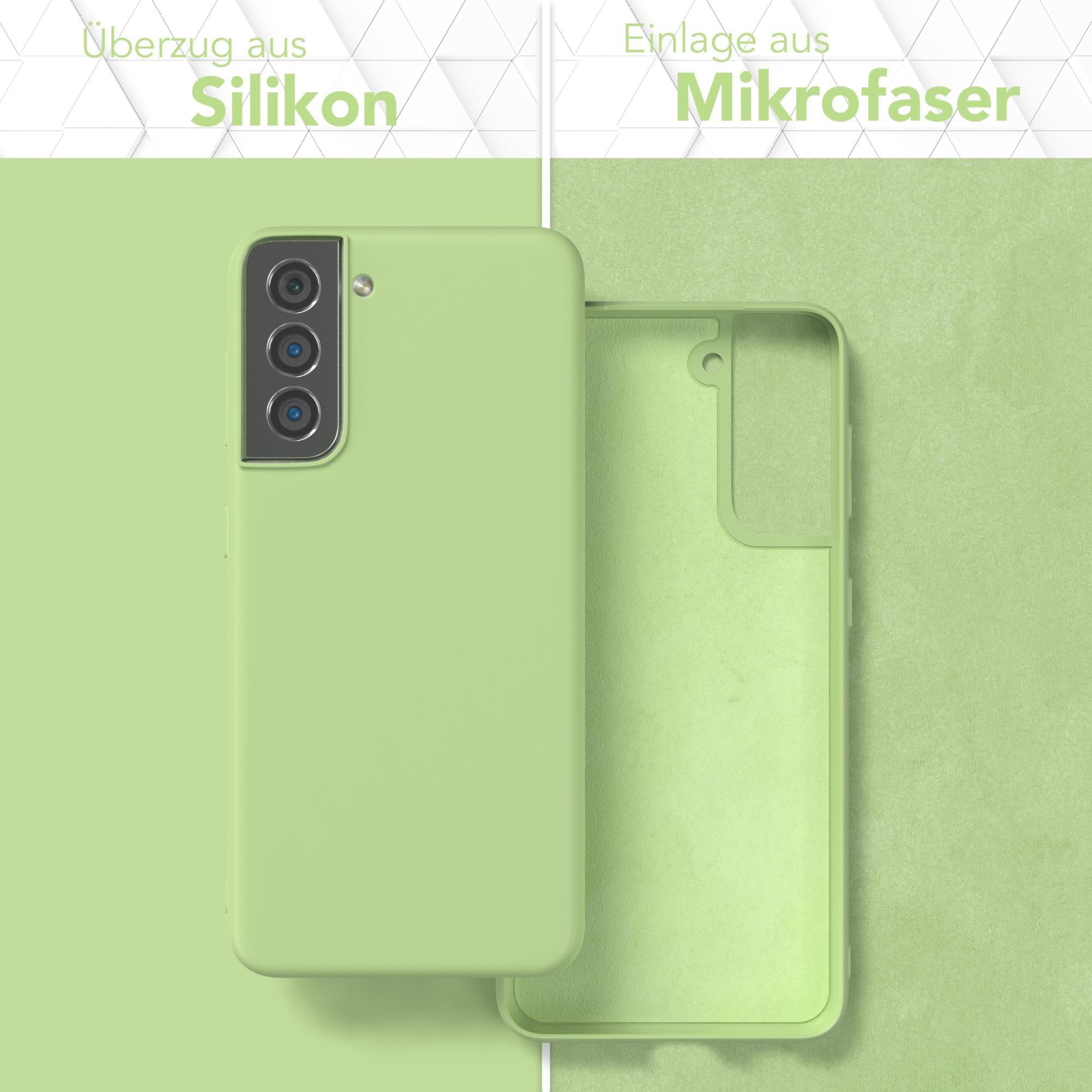 Grüne Handyhülle mit grünem Innenraum neben einem grünen Mikrofasergewebe. Der Text lautet 'Silikon' und 'Mikrofaser'.
