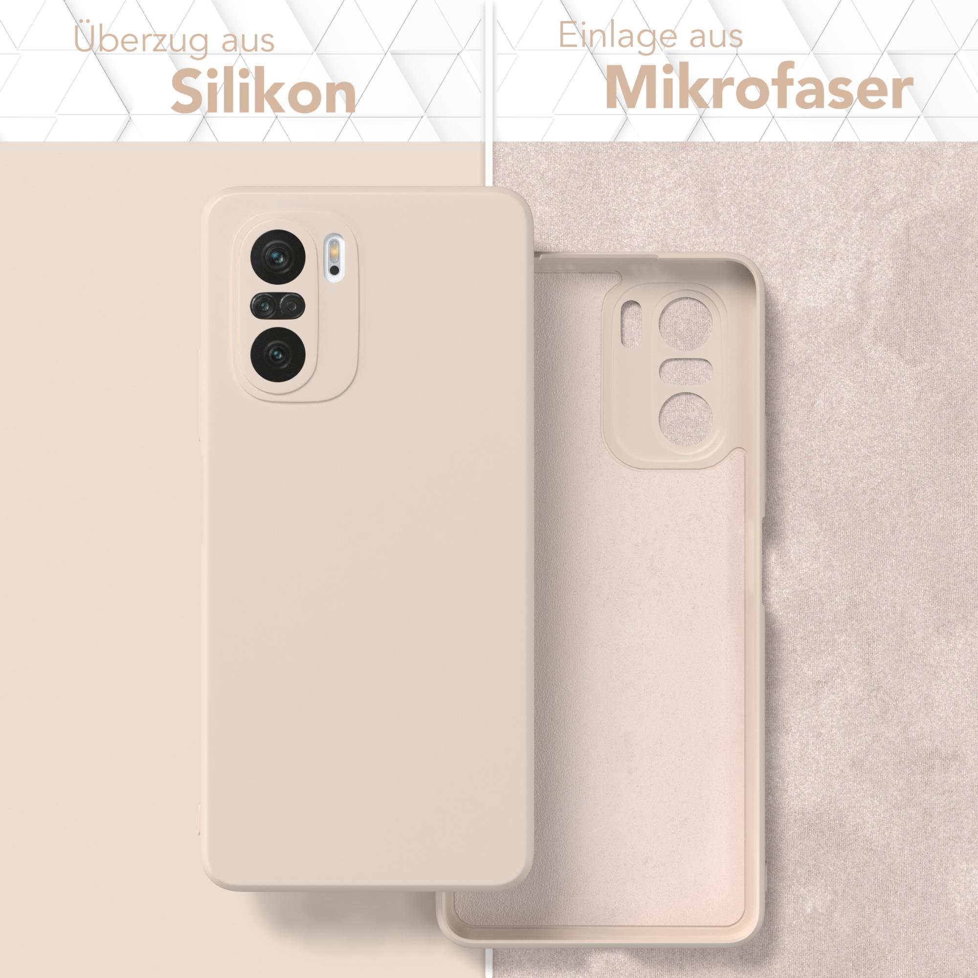 Eine Handyhülle, geöffnet, die Innenseite zeigend. Links beige, rechts die Innenseite beige.