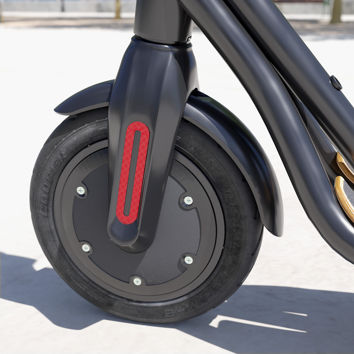 Nahaufnahme eines schwarzen E-Scooter-Rads mit rotem Reflektor auf weißer Oberfläche.