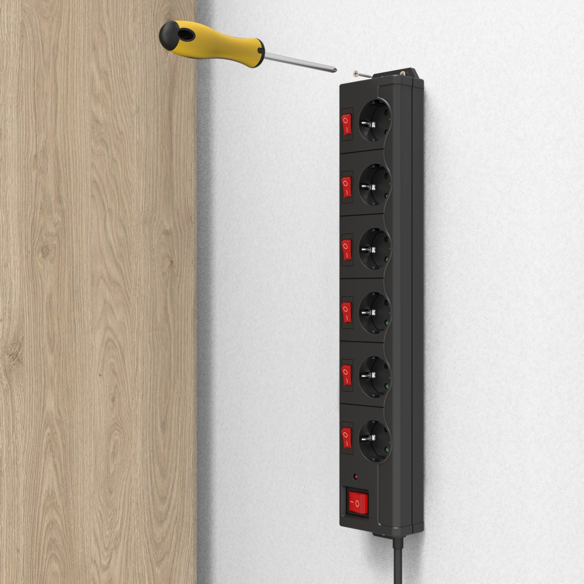 Czarny przedłużacz zamontowany na ścianie. Śrubokręt nad nim, gotowy do wkręcania.