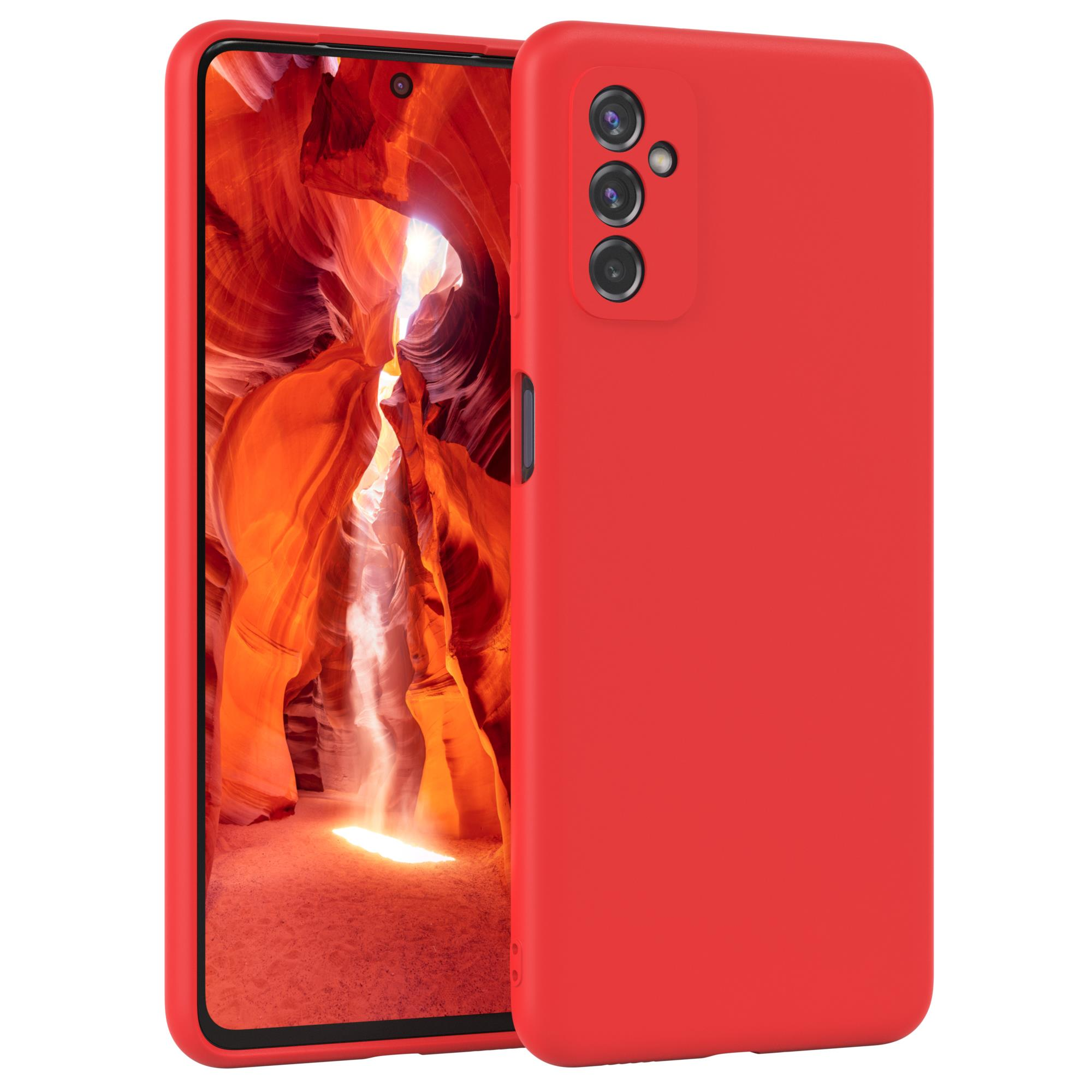 Rote Handyhülle mit Telefon, das ein Canyon-Bild auf dem Bildschirm zeigt.