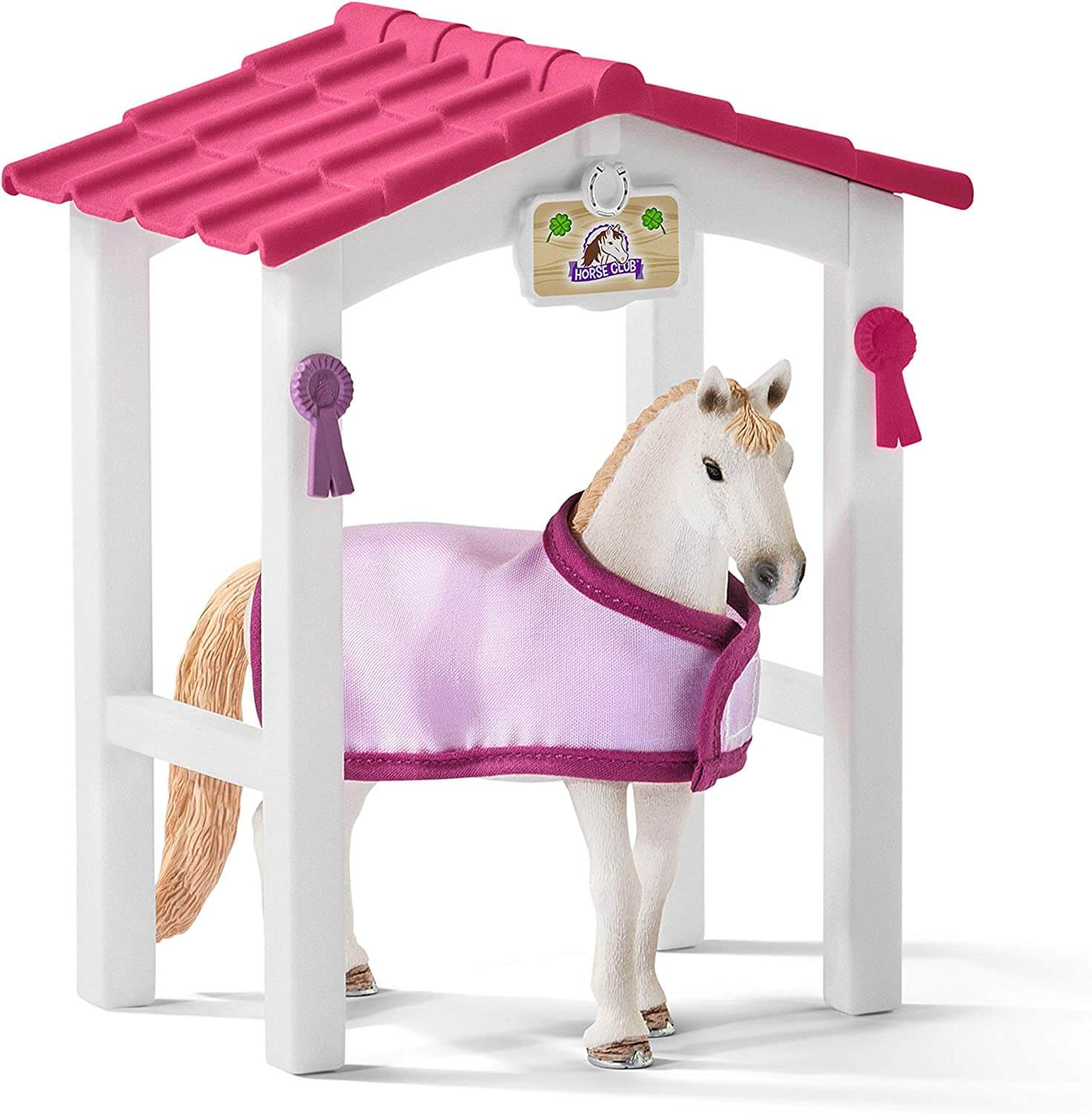 Spielzeugpferd in einem Stall. Der Stall hat ein rosa Dach, das Pferd einen rosa Mantel.