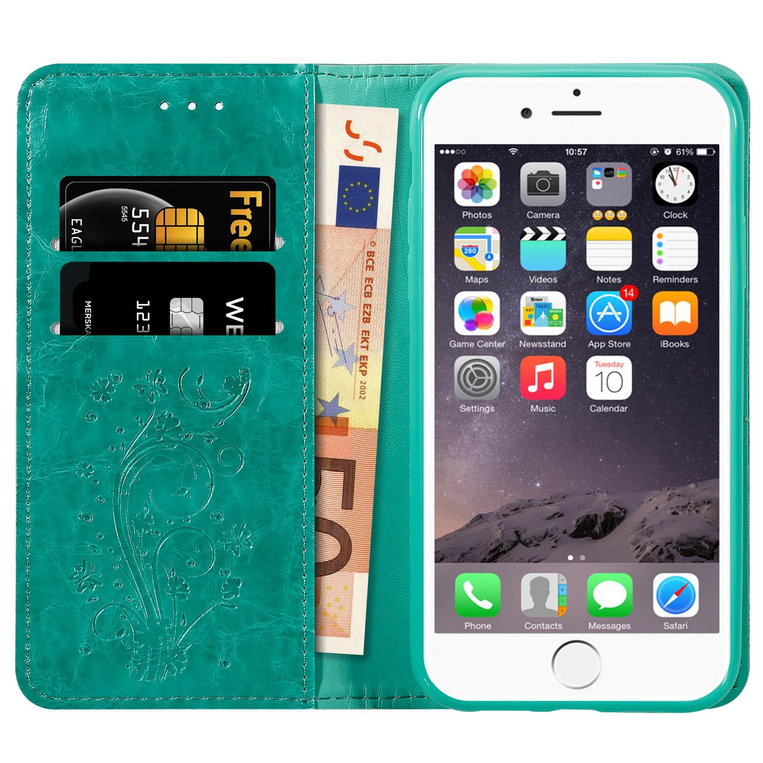 Smartphone in einer türkisblauen Brieftasche, mit Karten und Währung sichtbar.