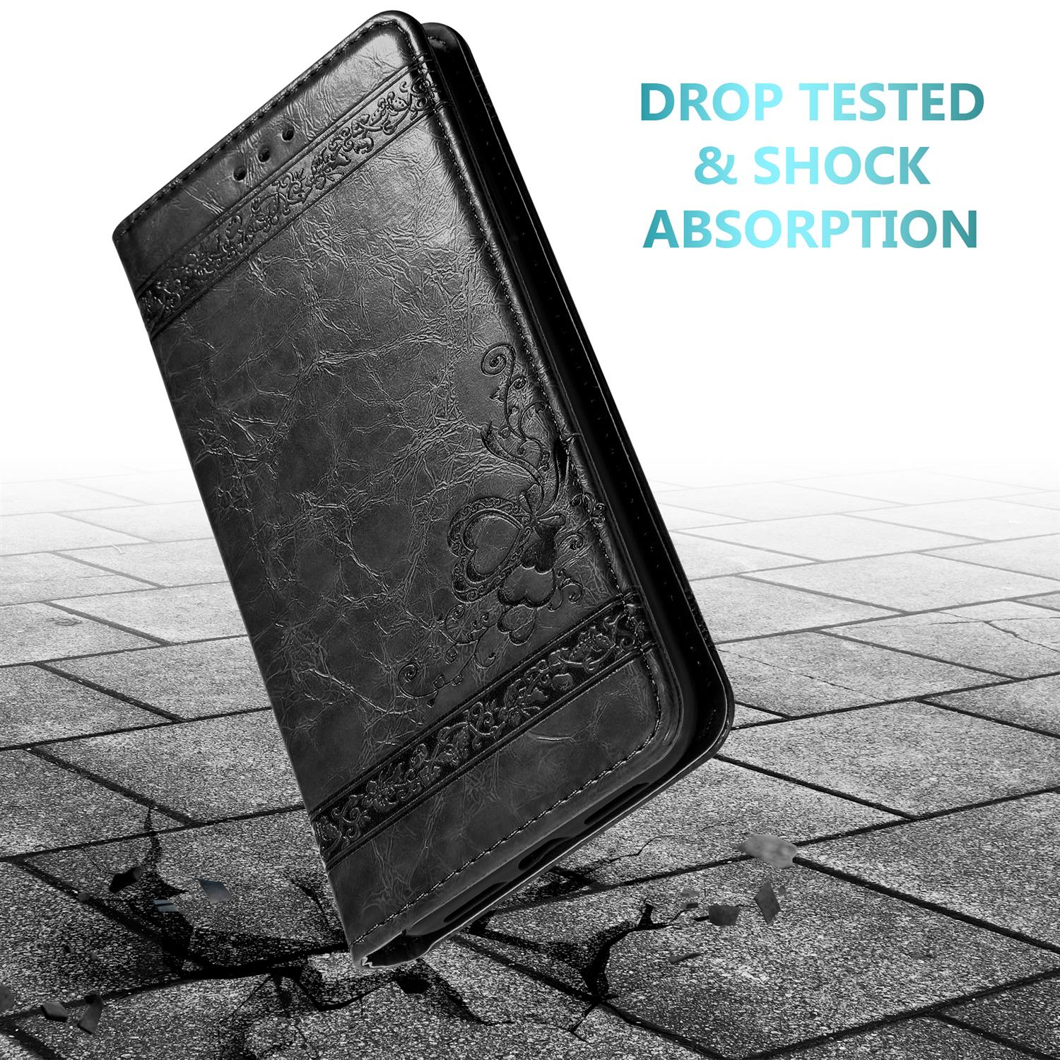 Schwarze Handyhülle auf rissiger Oberfläche, mit Text 'Drop Tested & Shock Absorption'.