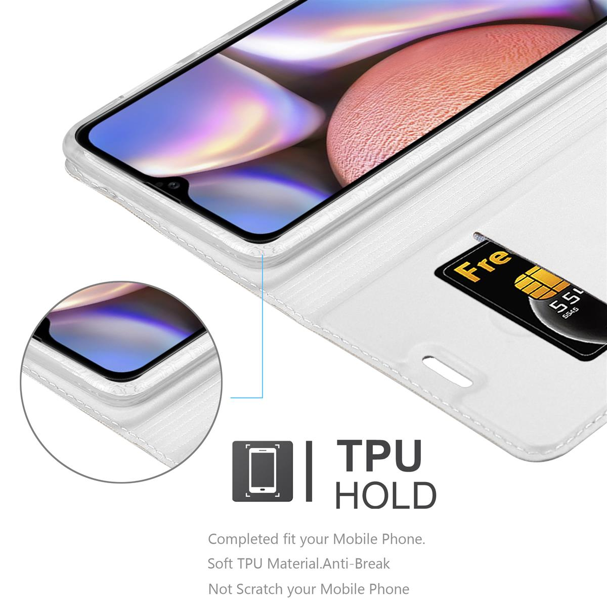 Nahaufnahme eines Telefons in einem weißen Gehäuse mit einer Karte. Text: TPU HOLD.