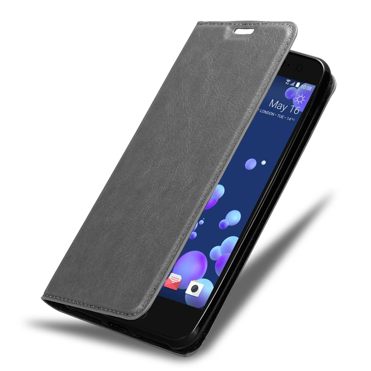 Eine Handyhülle mit Telefon, das Datum und Uhrzeit anzeigt. Die Hülle ist offen und zeigt das Telefon.