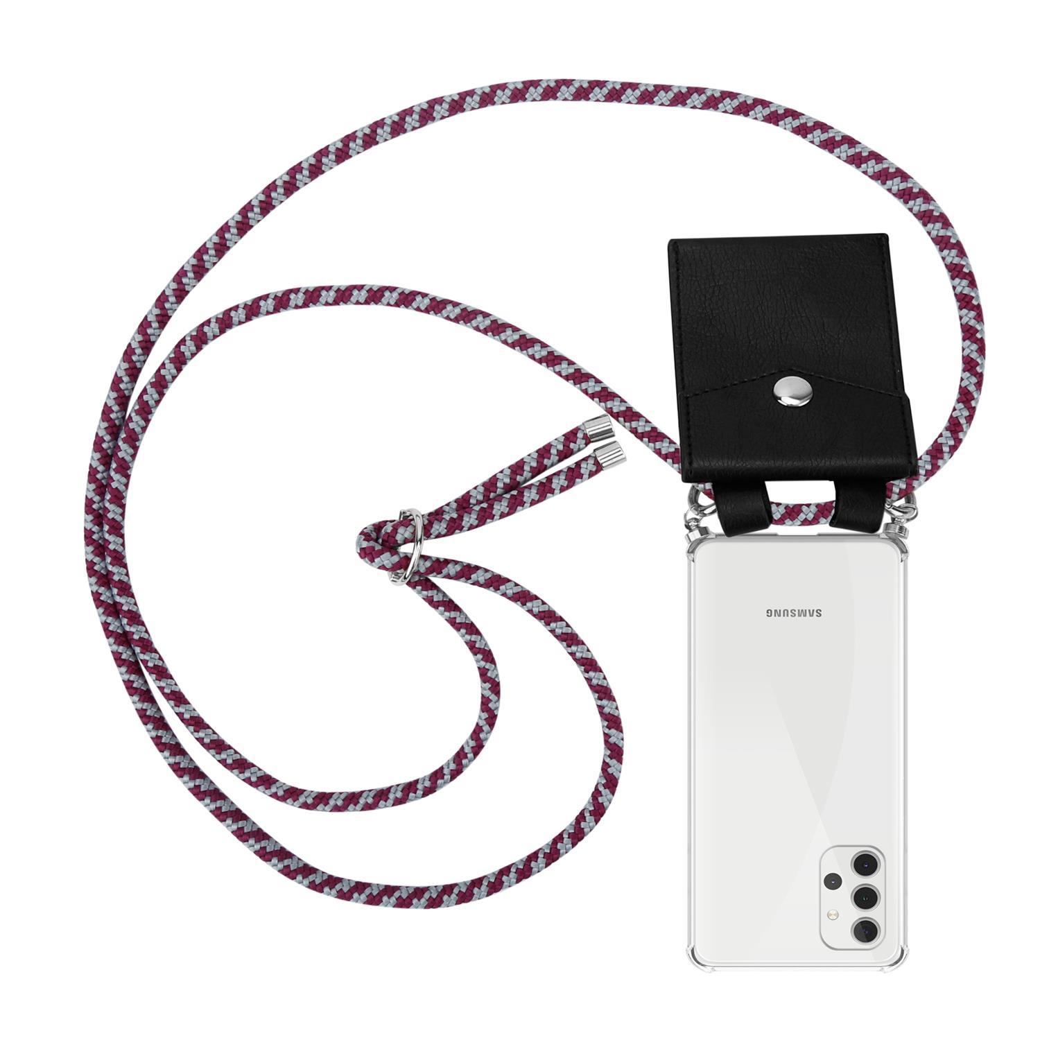 Telefon mit schwarzem Gehäuse, befestigt an einer Schnur mit Schwarz-Weiß-Design.