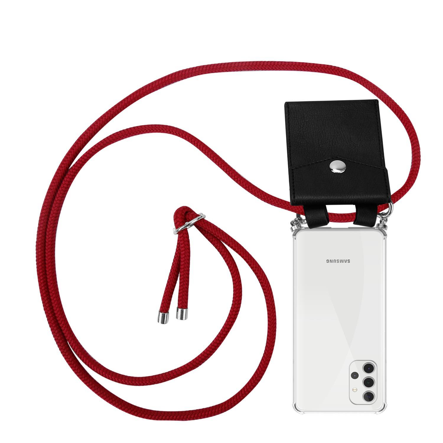 Rotes Telefon-Umhängeband mit schwarzer Handyhülle und Telefon.