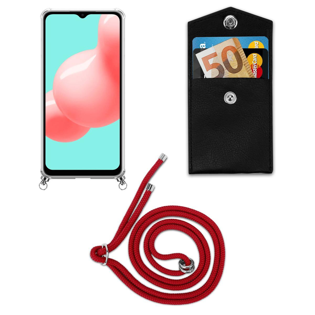 Ein Telefon mit Hülle, eine rote Kordel und eine schwarze Geldbörse mit Karten darin. Weißer Hintergrund.
