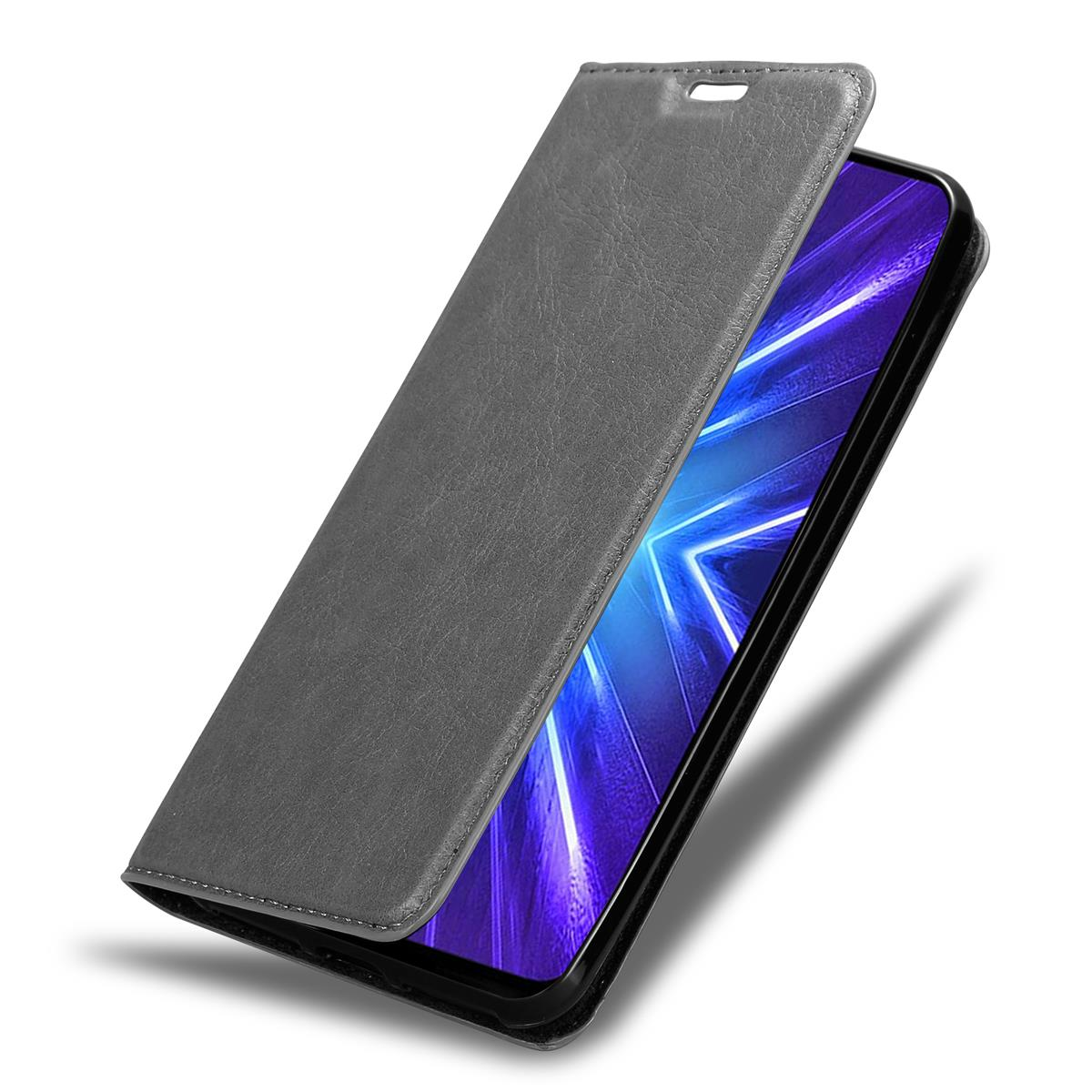 Graue Handyhülle, offen, Telefon sichtbar. Dunkler Hintergrund, schräge Ansicht.