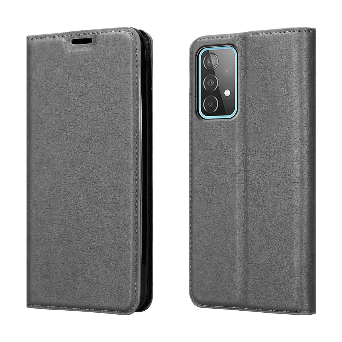 Zwei graue Handyhüllen offen, in einer ist ein Telefon sichtbar. Schwarze Nähte sichtbar.