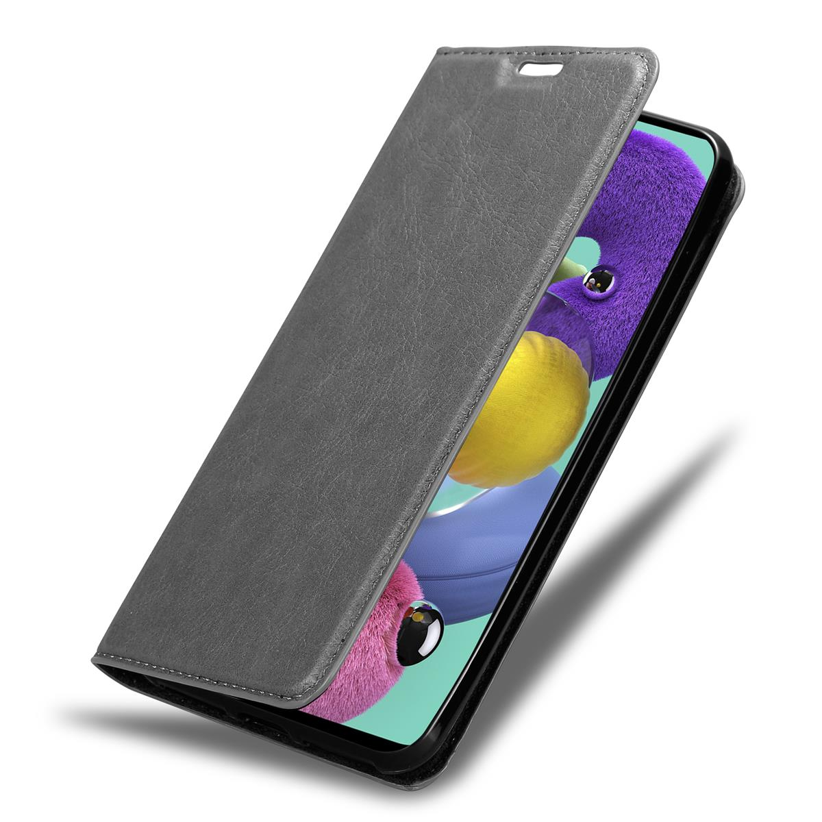 Eine graue Handyhülle, offen, zeigt ein Telefon mit lila, gelben und rosa Farben.
