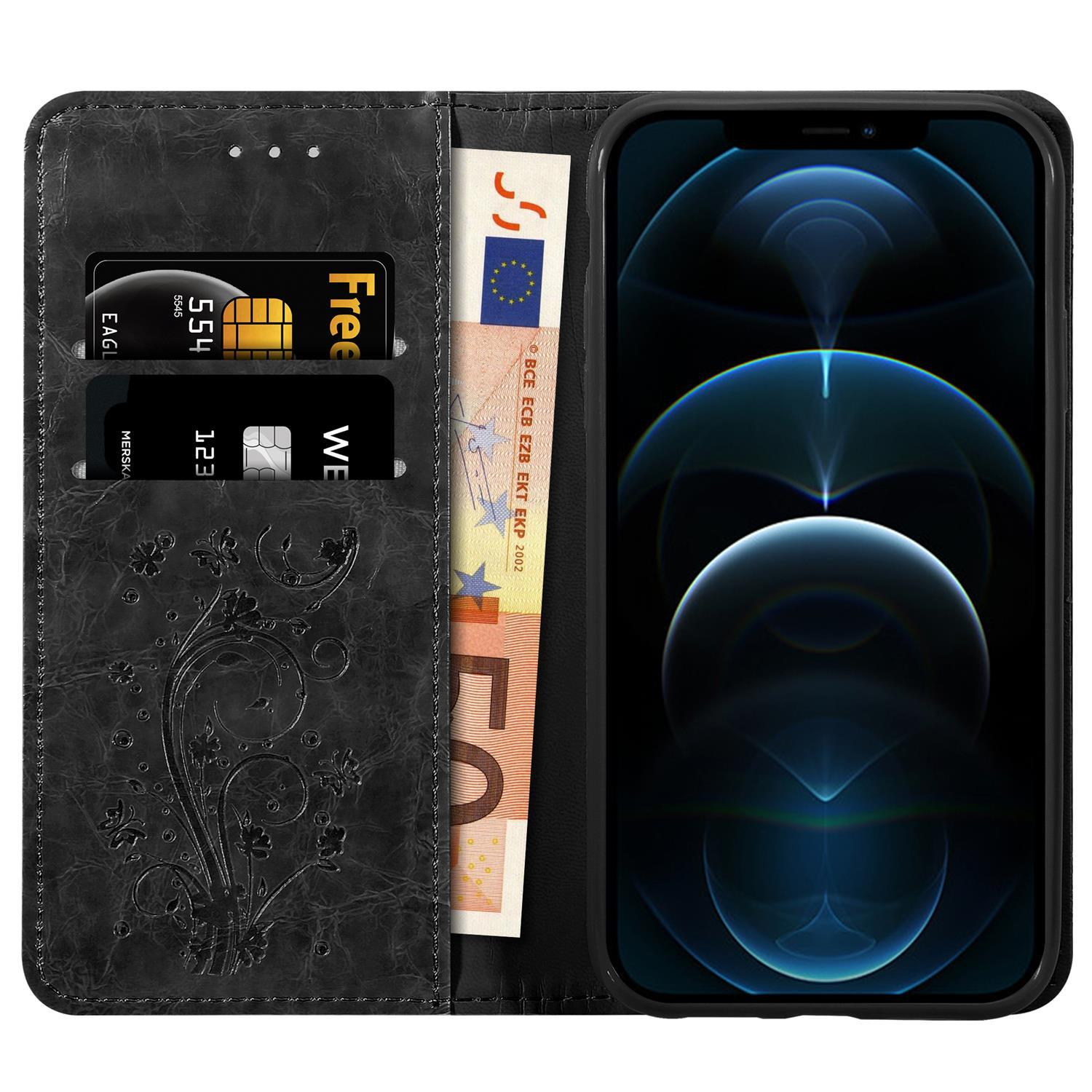 Custodia nera per telefono, aperta, che mostra telefono, carte e una banconota da 50 euro. Design floreale sulla custodia. Interno nero.