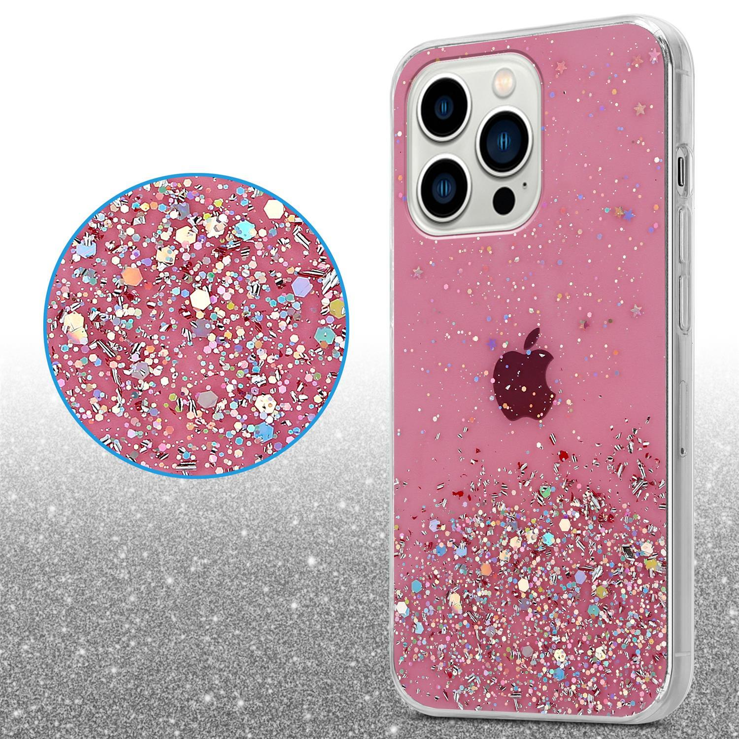 Pinke Handyhülle mit Glitzer. Apple-Logo auf dem Telefon. Eine Lupe zeigt das Glitzerdetail.
