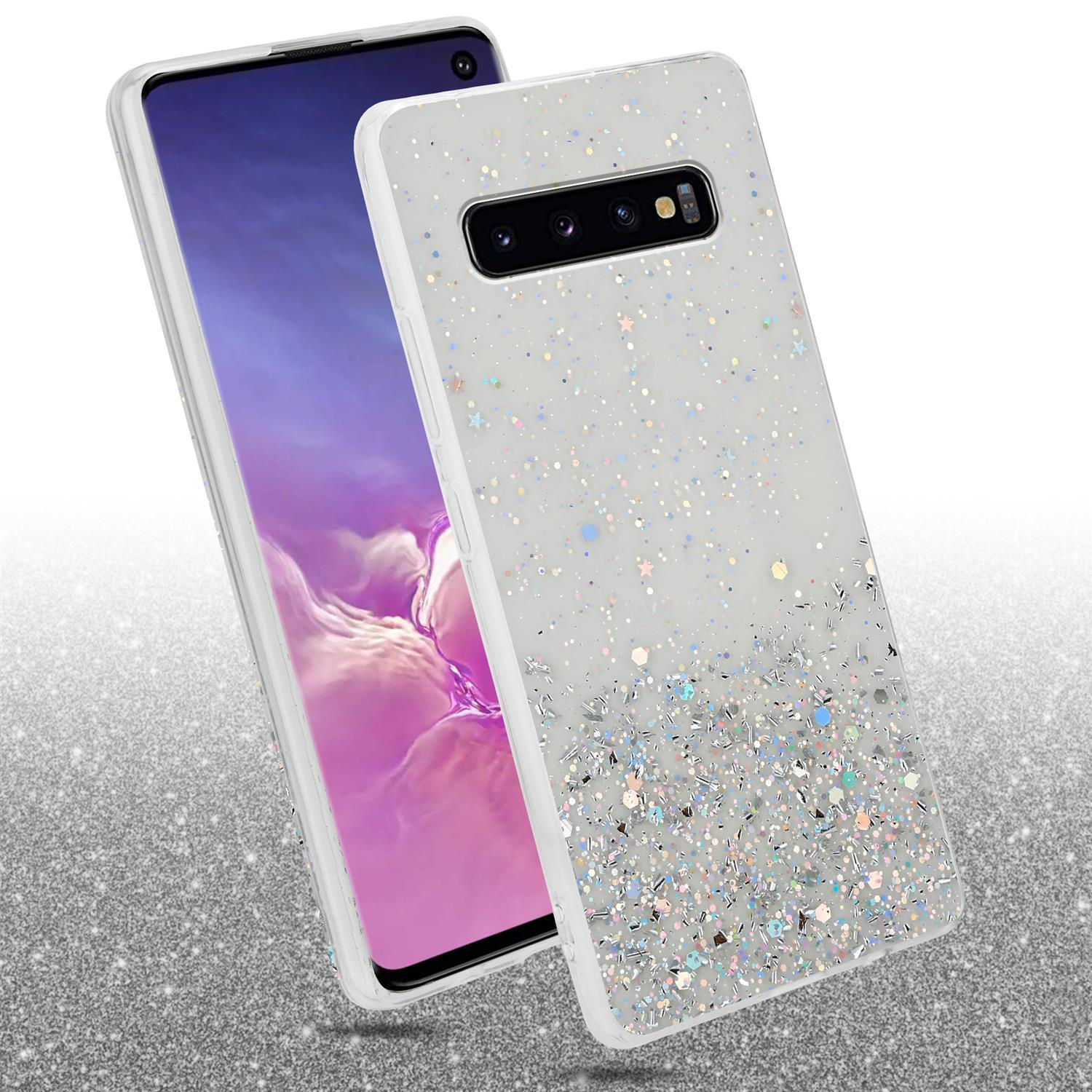 Weiße Handyhülle mit Glitzereffekt. Telefon darin. Die Hülle befindet sich auf einem Glitzerhintergrund. Bild gut beleuchtet.