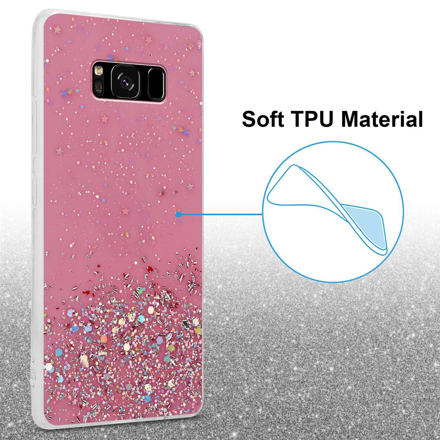 Rosa Handyhülle mit Glitzer. Text: Weiches TPU-Material. Glitzer am unteren Rand des Gehäuses konzentriert.