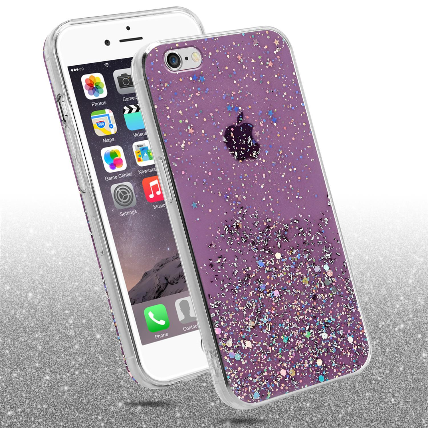 Zwei Telefone, eines mit lila Glitzerhülle und ein Telefon mit Apps auf dem Bildschirm. Silberner Glitzerhintergrund.
