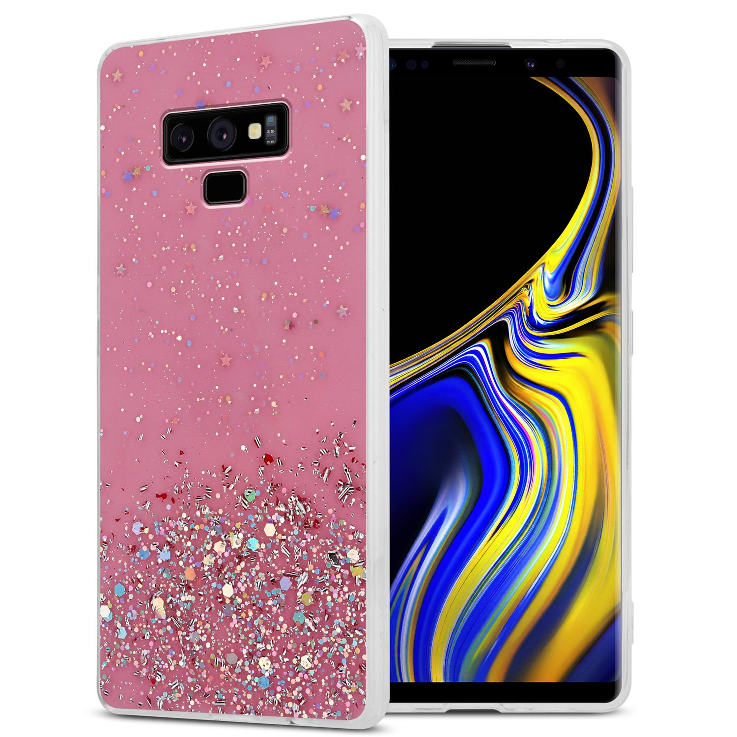 Rosa Handyhülle mit Glitzer. Sterne- und Konfetti-Design. Telefon mit schwarzem Bildschirm.
