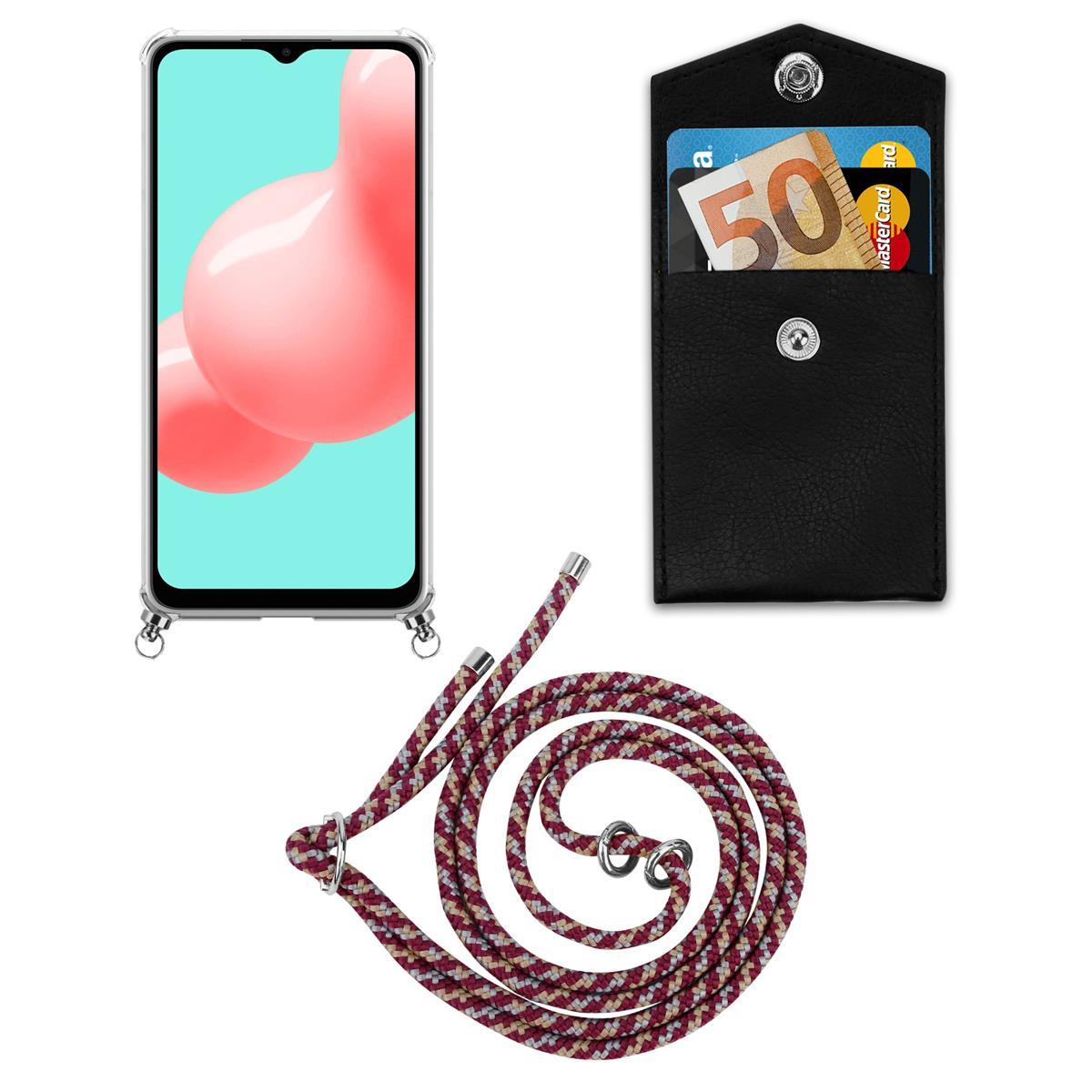 Ein Telefon, eine Brieftasche und ein Schlüsselband. Das Telefon befindet sich in einer Hülle. Die Brieftasche hat Karten.