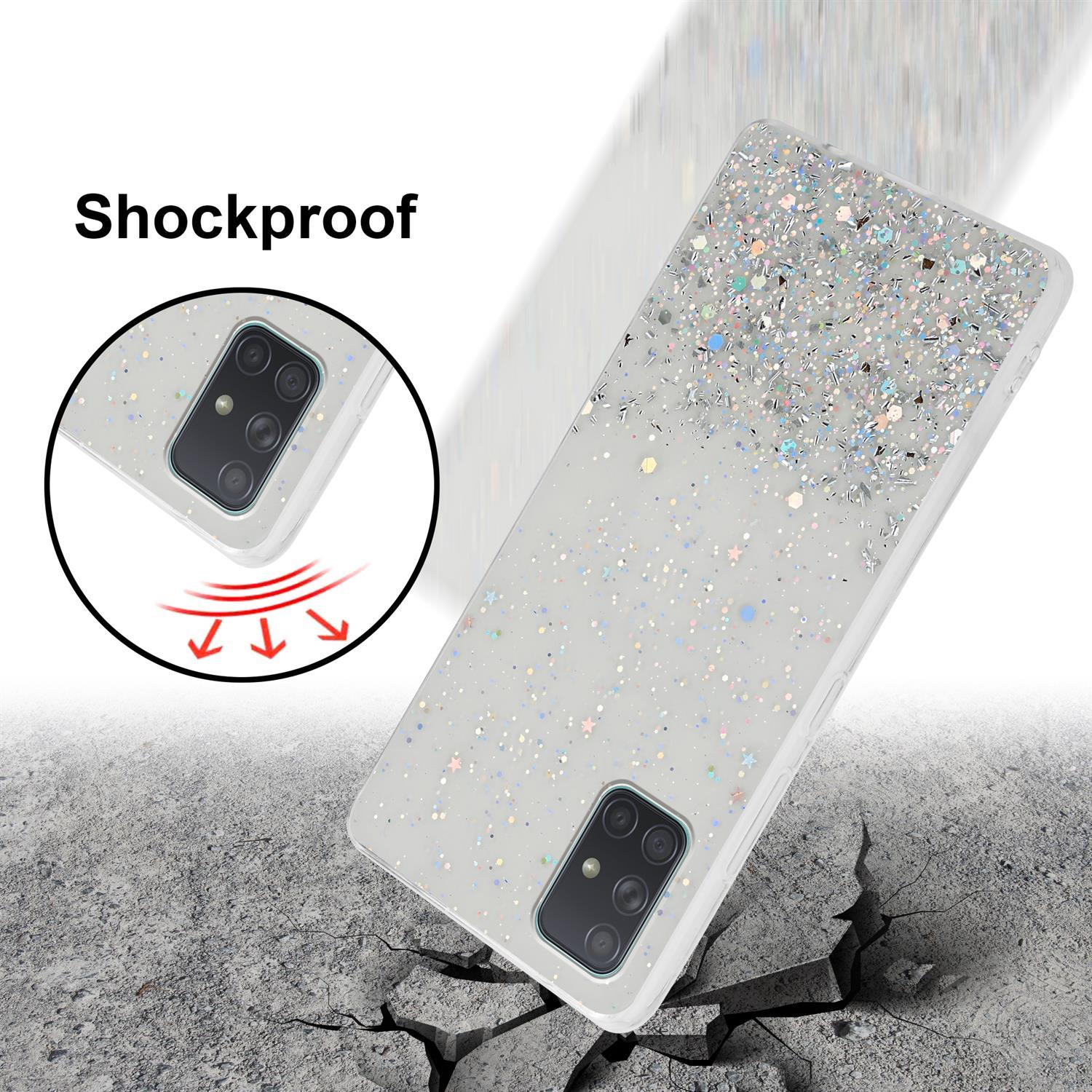 Telefon in Glitzerhülle. Stoßfestes Konzept. Pfeile zeigen Aufprall an. Rissiger Boden.