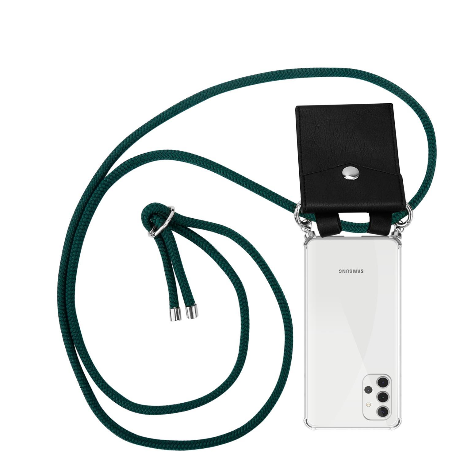 Telefon mit Trageriemen. Das Telefon befindet sich in einer transparenten Hülle mit einer schwarzen Ledertasche.