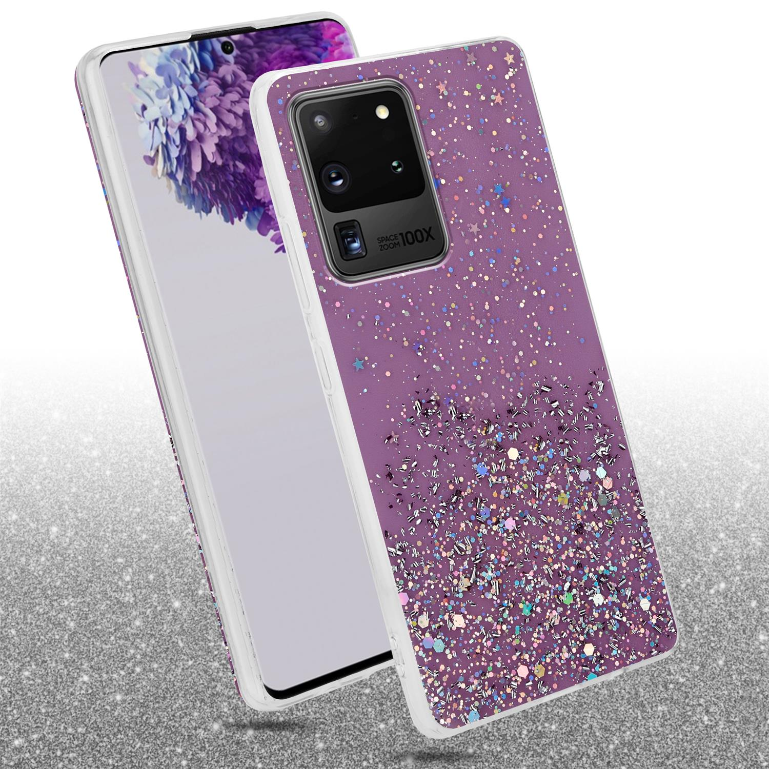 Un telefono con una cover viola glitter accanto al suo schermo.