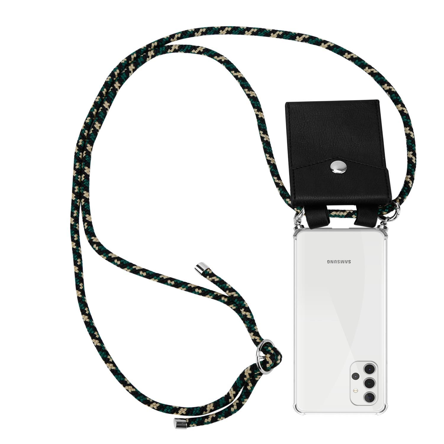 Telefon mit Lanyard, schwarzem Lederetui und grün-schwarzem Seil. Samsung-Telefon ist im Lanyard.
