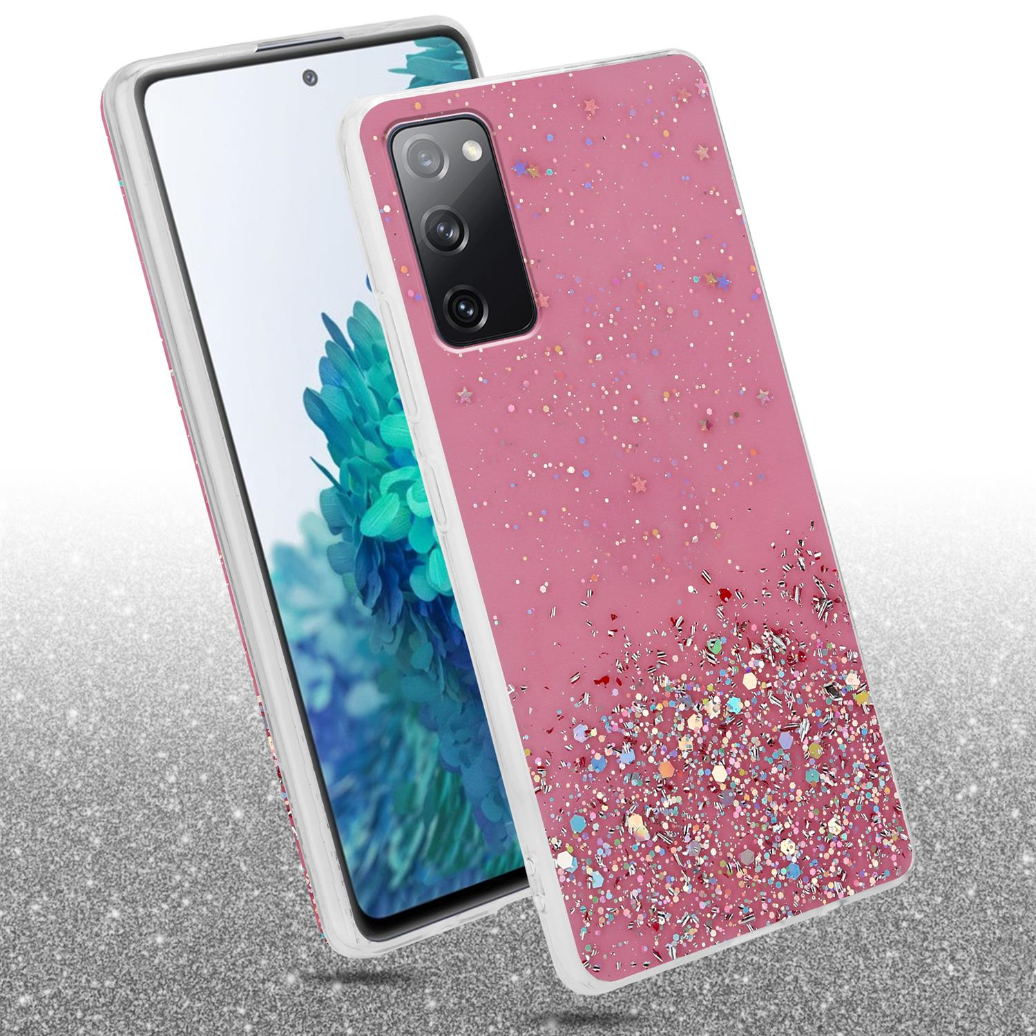 Eine rosa Glitzer-Handyhülle mit einem Telefon. Das Telefon ist weiß. Auf glitzernder Oberfläche.
