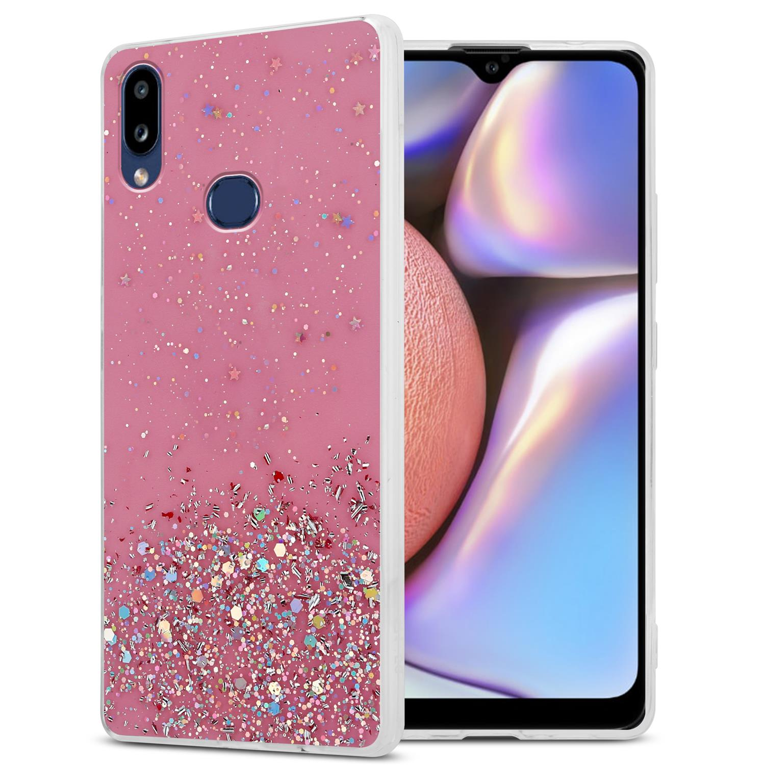 Rosa Handyhülle mit Glitzer und Sternen. Rechts ist ein Telefon sichtbar.