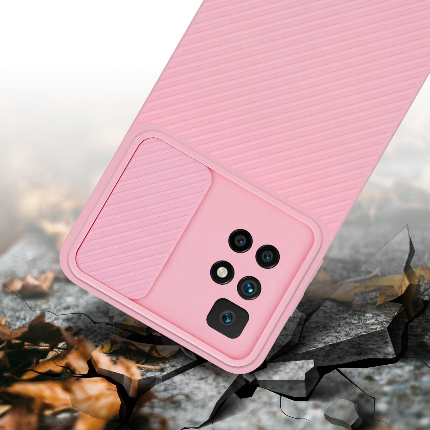 Custodia per telefono rosa con copertura per fotocamera su terreno incrinato. Mostra la protezione dalle cadute.