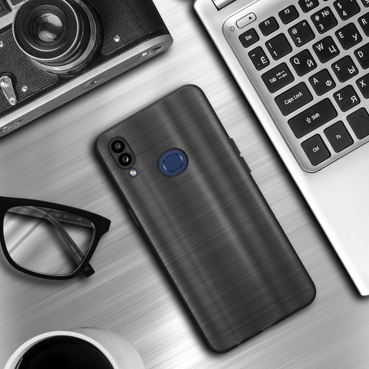 Custodia per telefono su una scrivania. Occhiali, laptop e fotocamera sono anche sulla scrivania.