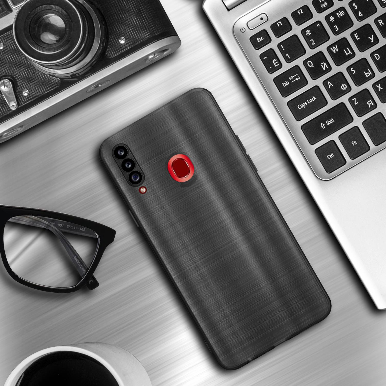 Un telefono su una scrivania con occhiali e un laptop. La custodia del telefono ha un aspetto in metallo spazzolato.